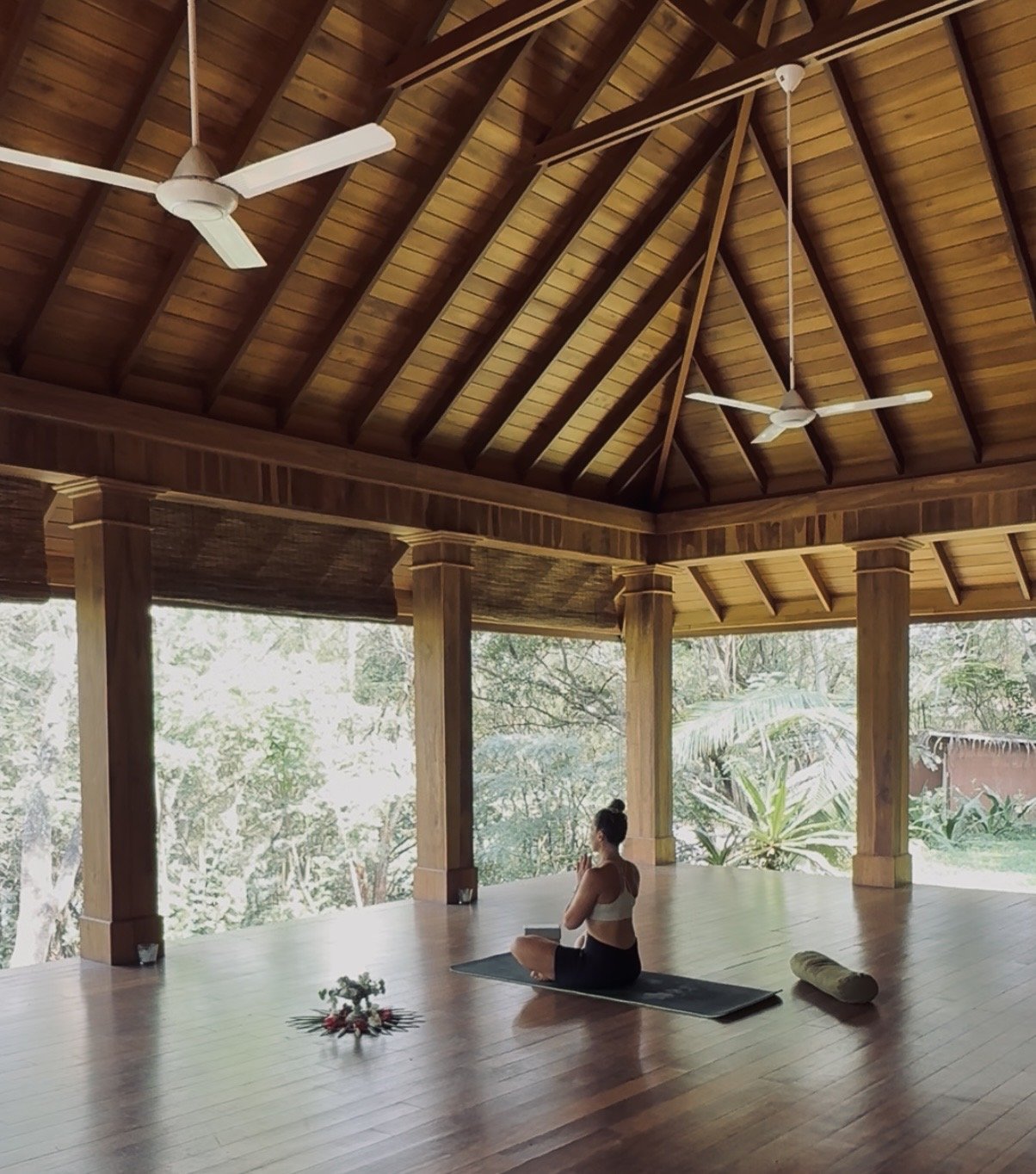 Yoga practice in a peaceful open-air yoga shala surrounded by nature in Sri Lanka