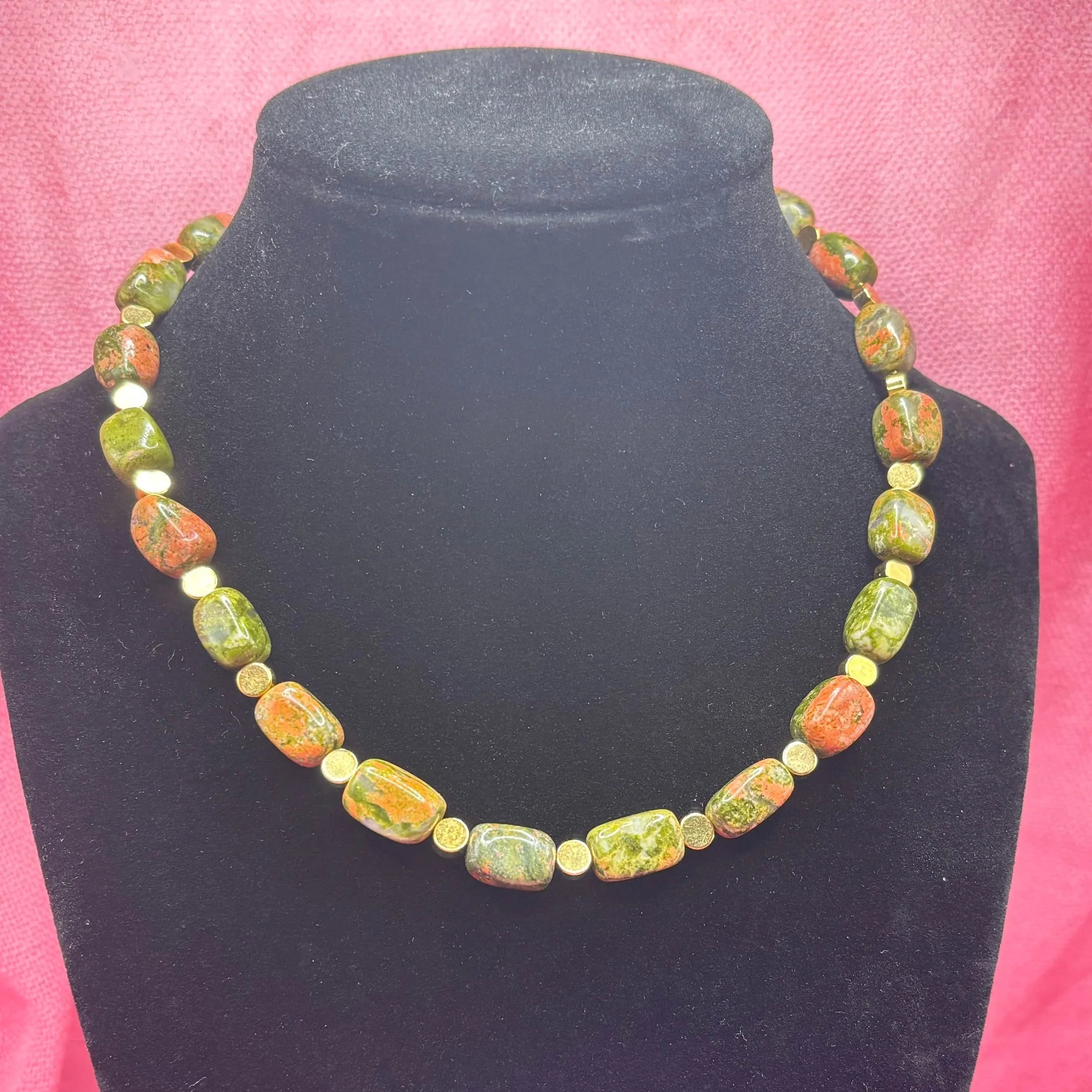 Casual enough for the work place but still able to be dressed up for a date night, this Unakite and gold plated choker is certain to turn heads and receive compliments. 