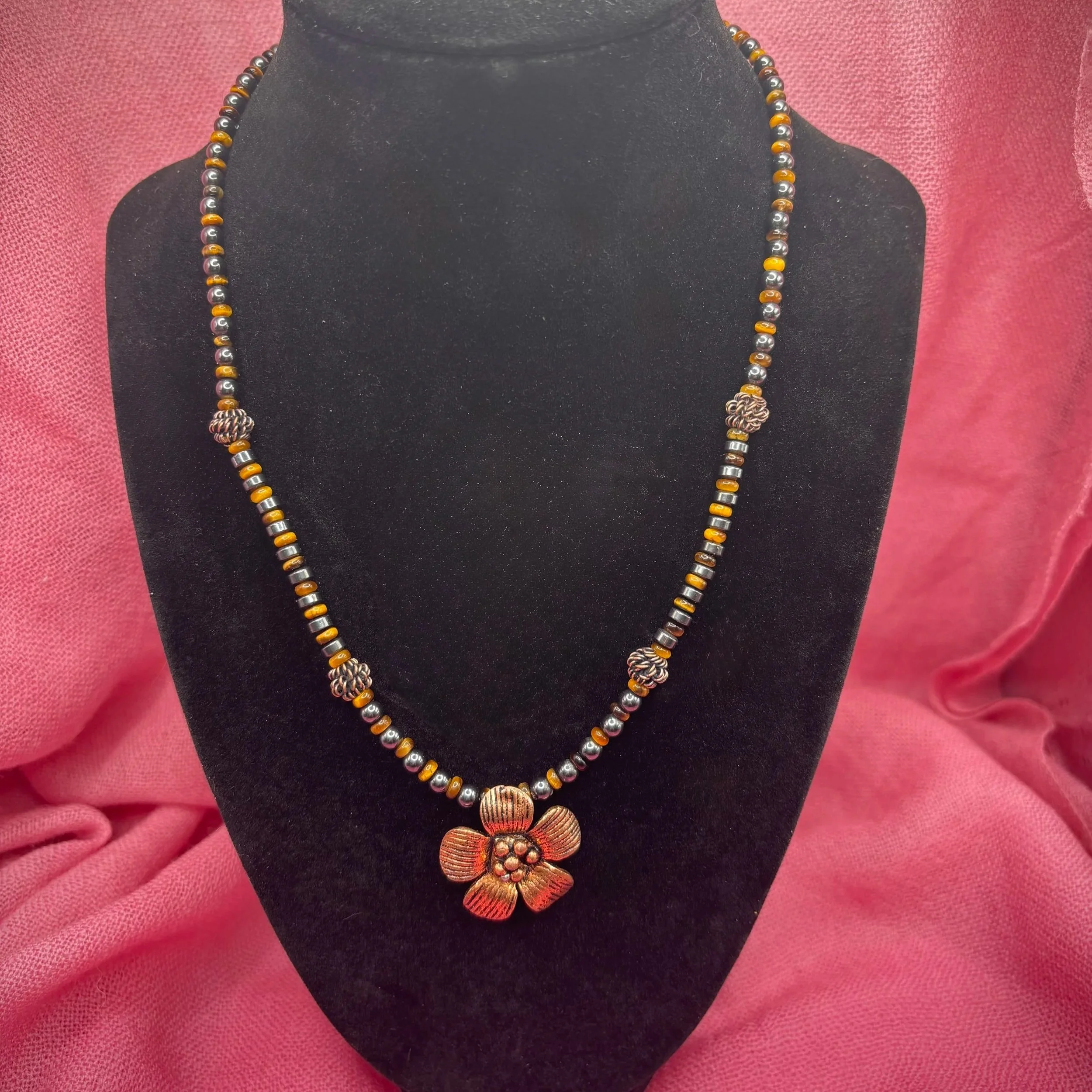 The perfect choice to elevate and enhance any outfit. Hematite, Tigers Eye, and handmade copper accents come together harmoniously  to help bring out your inner glow. 