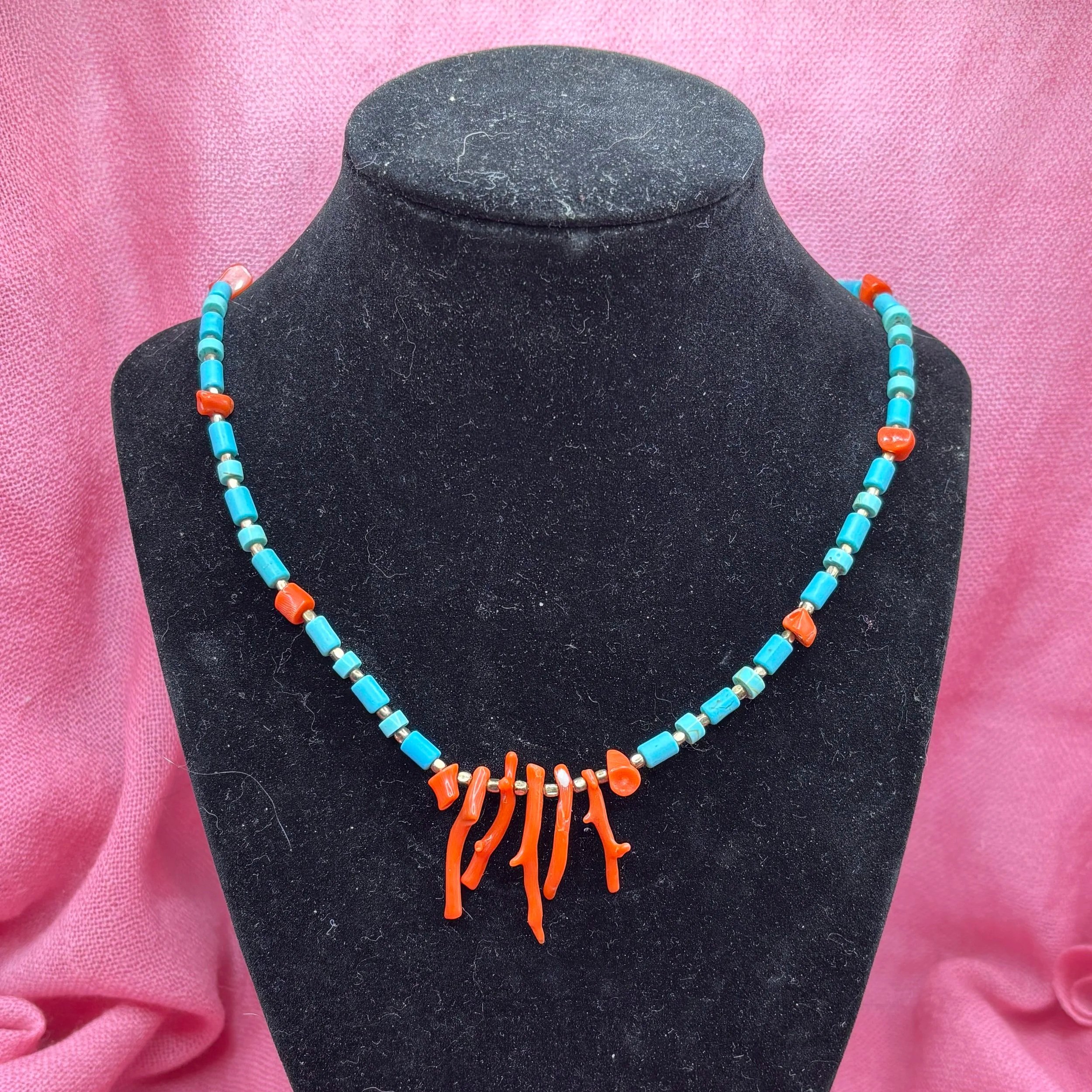 Made using vintage coral beads, genuine Turquoise, and brass, this simple yet elegant necklace is the perfect accessory for any summery outfit. 