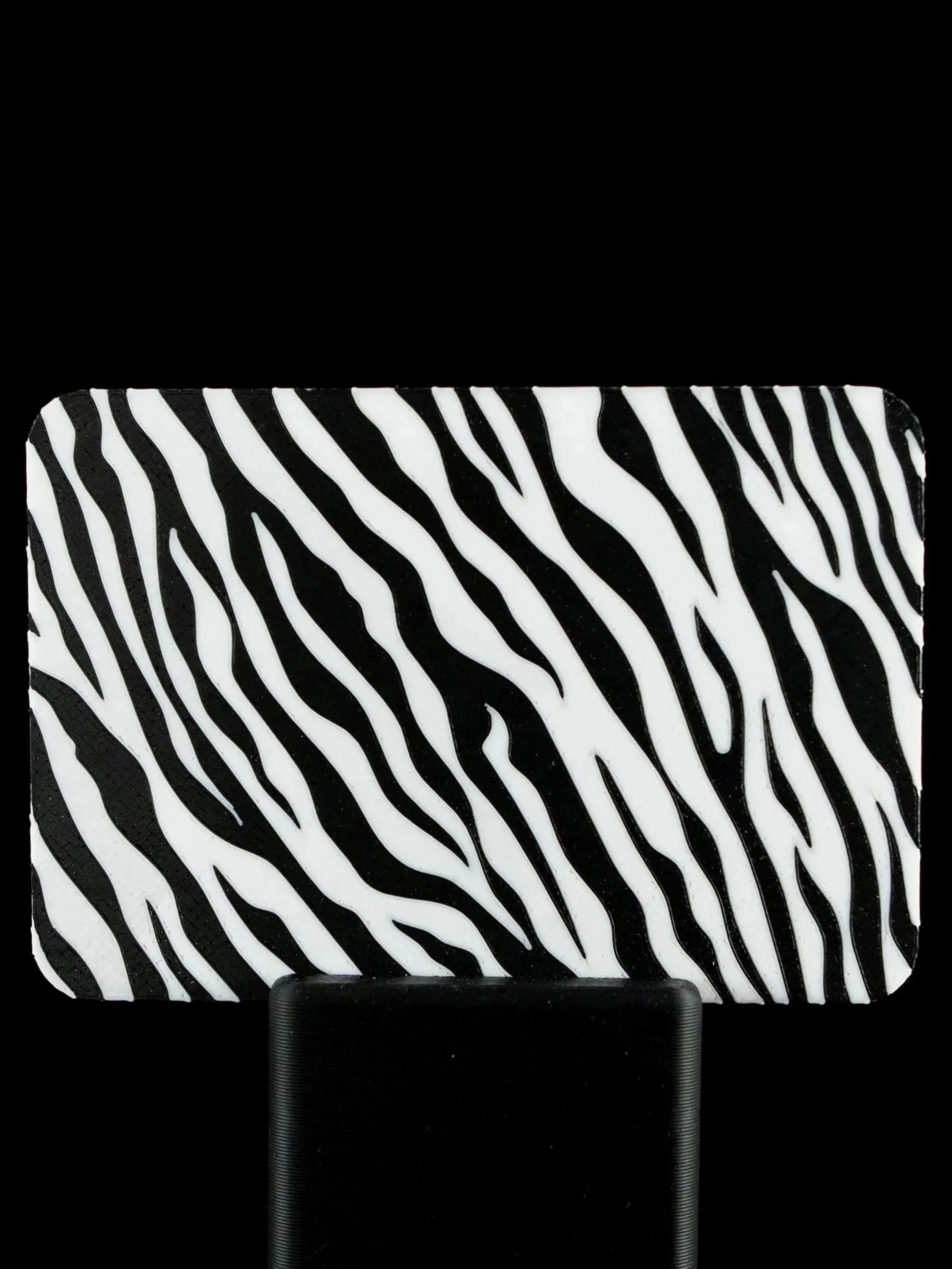 Close-up of a zebra pattern on back of custom 3D printed NFC business card.