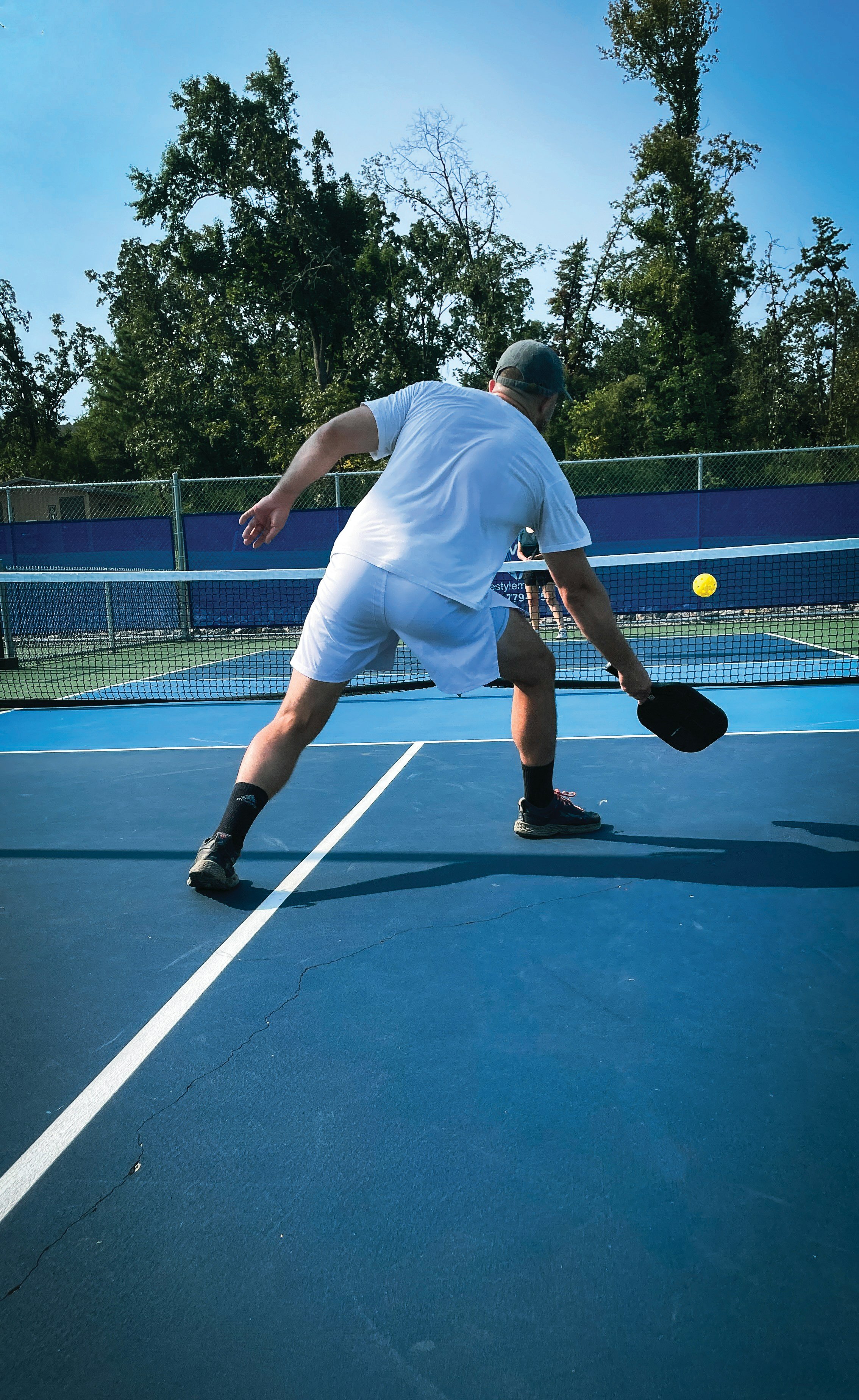 Pickleball player on the pickleball court playing pickleball singles