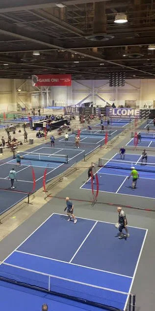Jam On It Indoor pickleball courts with multiple players in action.