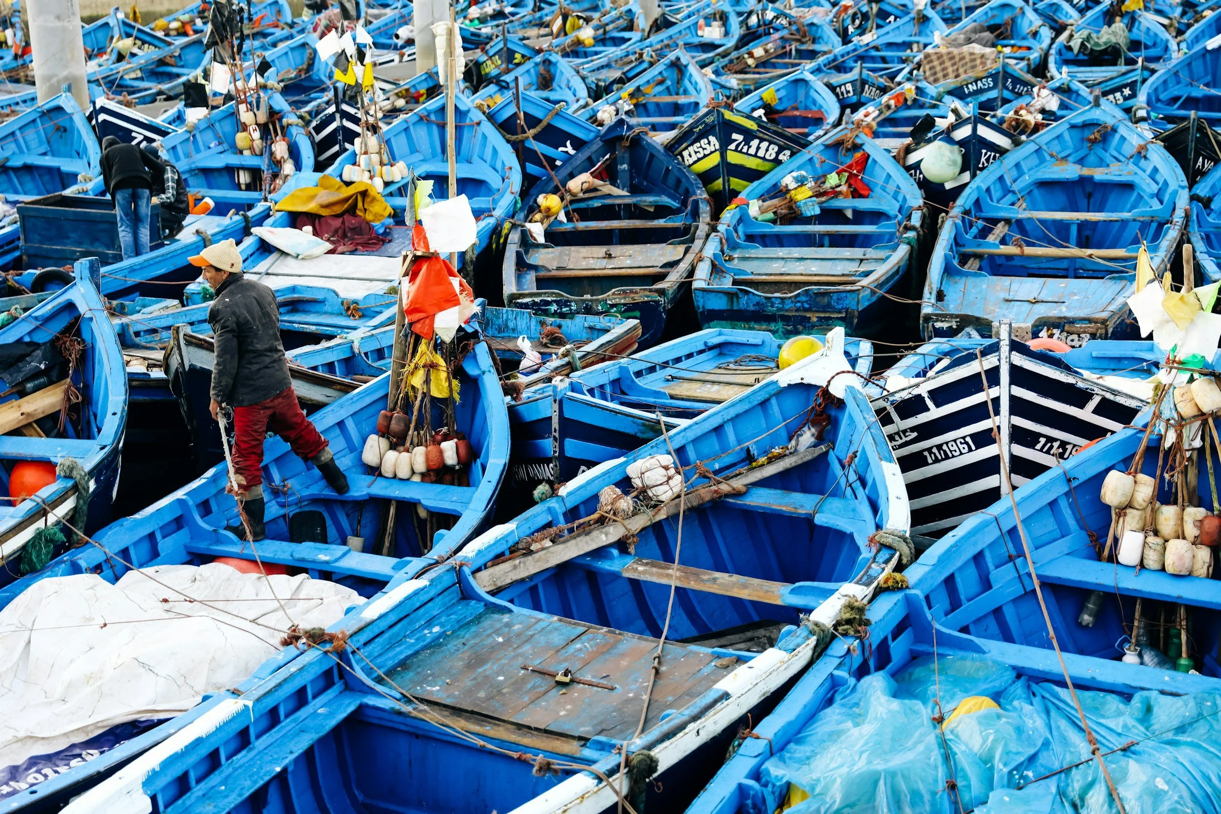 Blue fishing boats in the harbor at Essaouira Morocco.