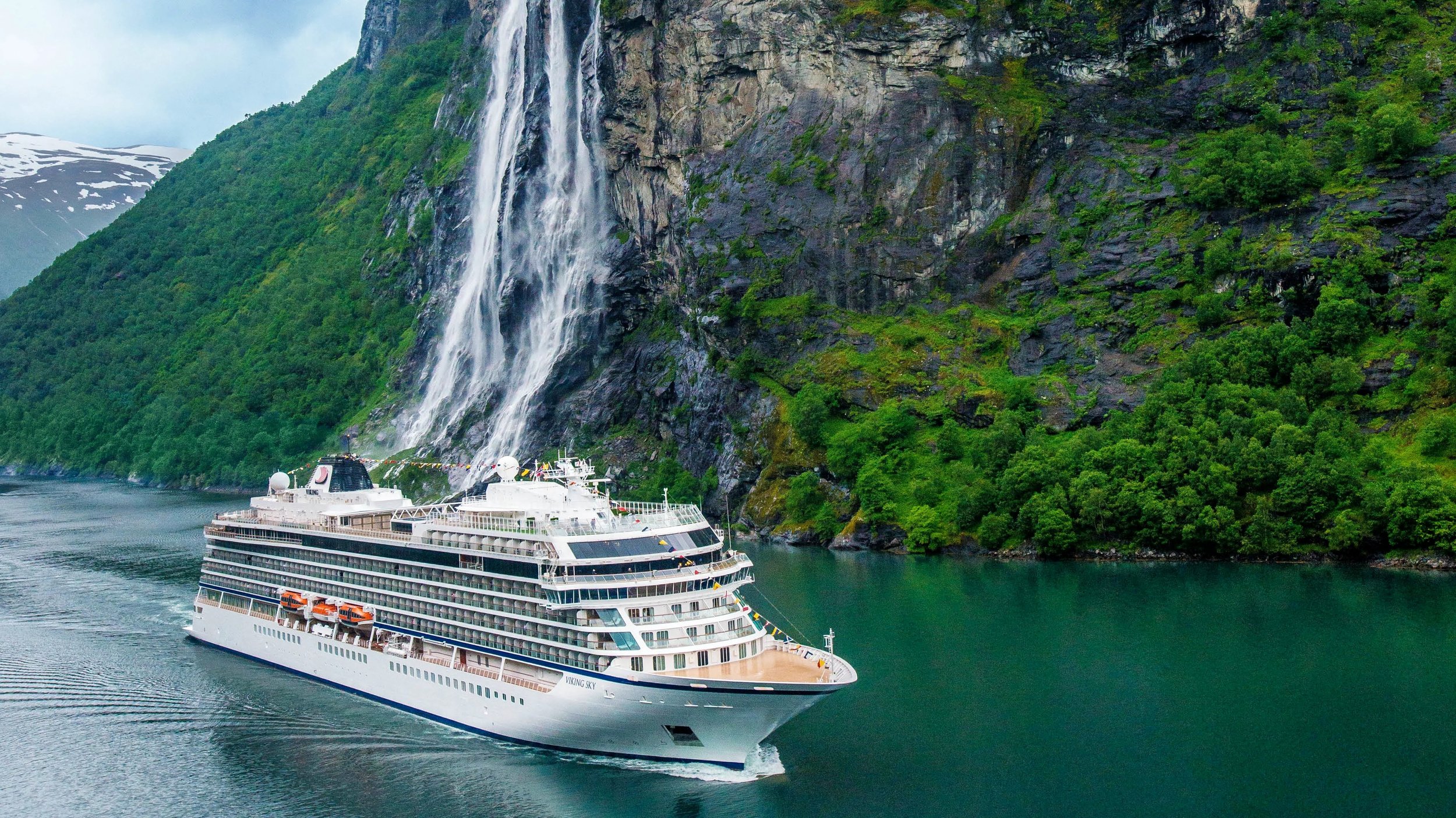 Viking ocean ship sailing through a Norwegian fjord.
