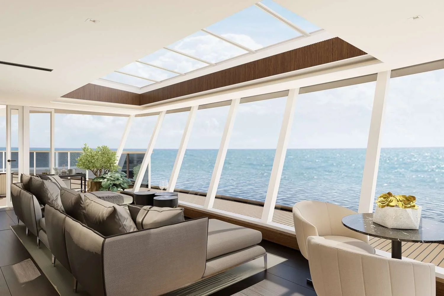 Modern living room with large windows showing ocean view, beige sofa, white chairs, and decorative plants.