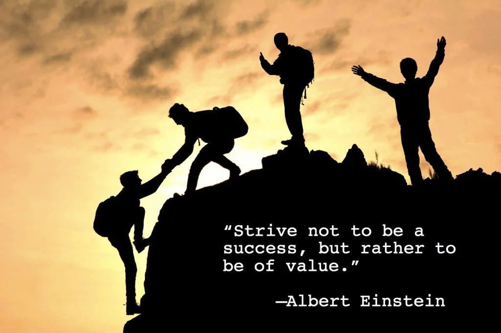 Silhouettes of five people on a mountain at sunset, with one person helping another climb. Two others are standing and waving or gesturing in the background. Overlaid quote reads, 'Strive not to be a success, but rather to be of value.' - Albert Einstein.
