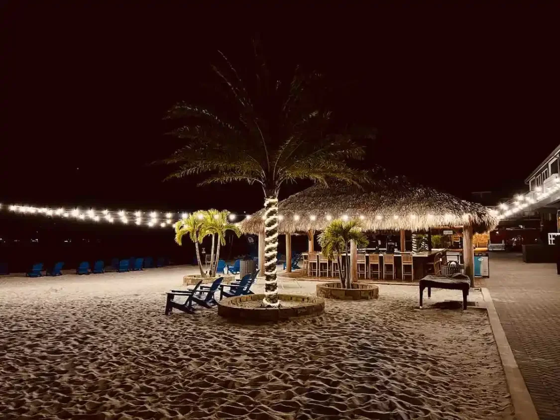 Fishermens-Village-Punta-Gorda-beach-at-night.webp