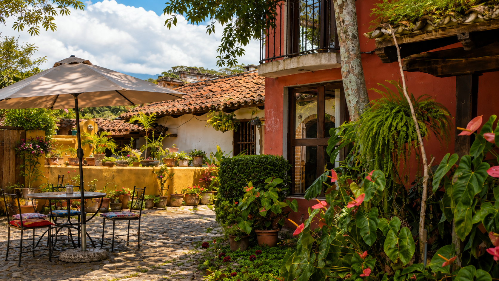 Colorful courtyard surrounded by lush tropical plants in Antigua, Guatemala