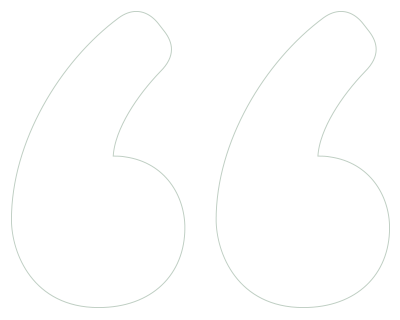 Two large curly quotation mark symbols.