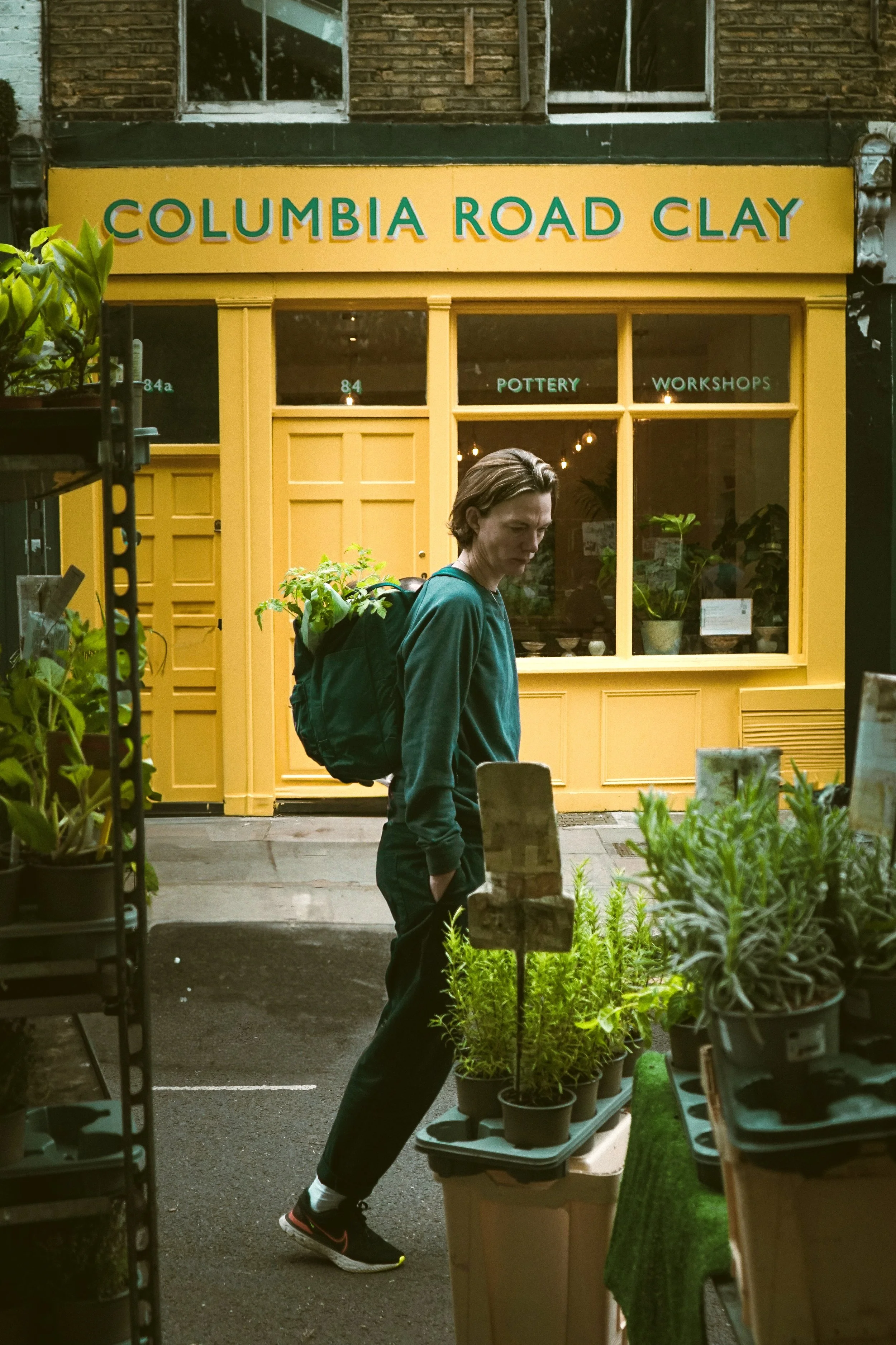 Yellow flower shopfront with plants outside on Columbia Road, London.
