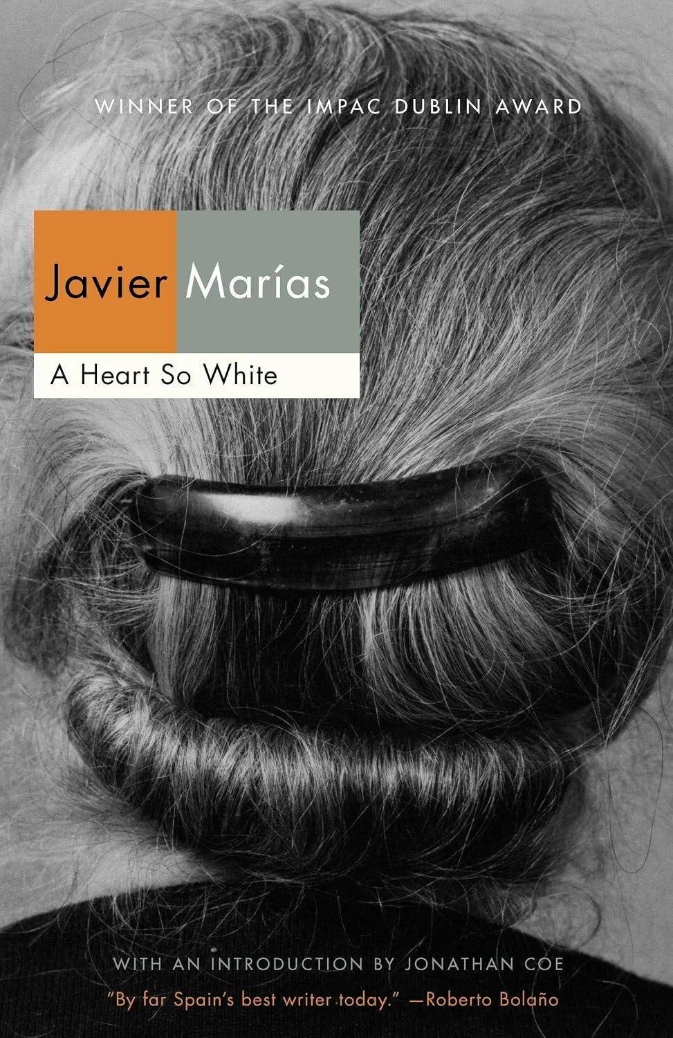 Cover of the book "A Heart So White" by Javier Marías, featuring a black-and-white photograph of a woman with gray hair held in a hair clip, viewed from behind.