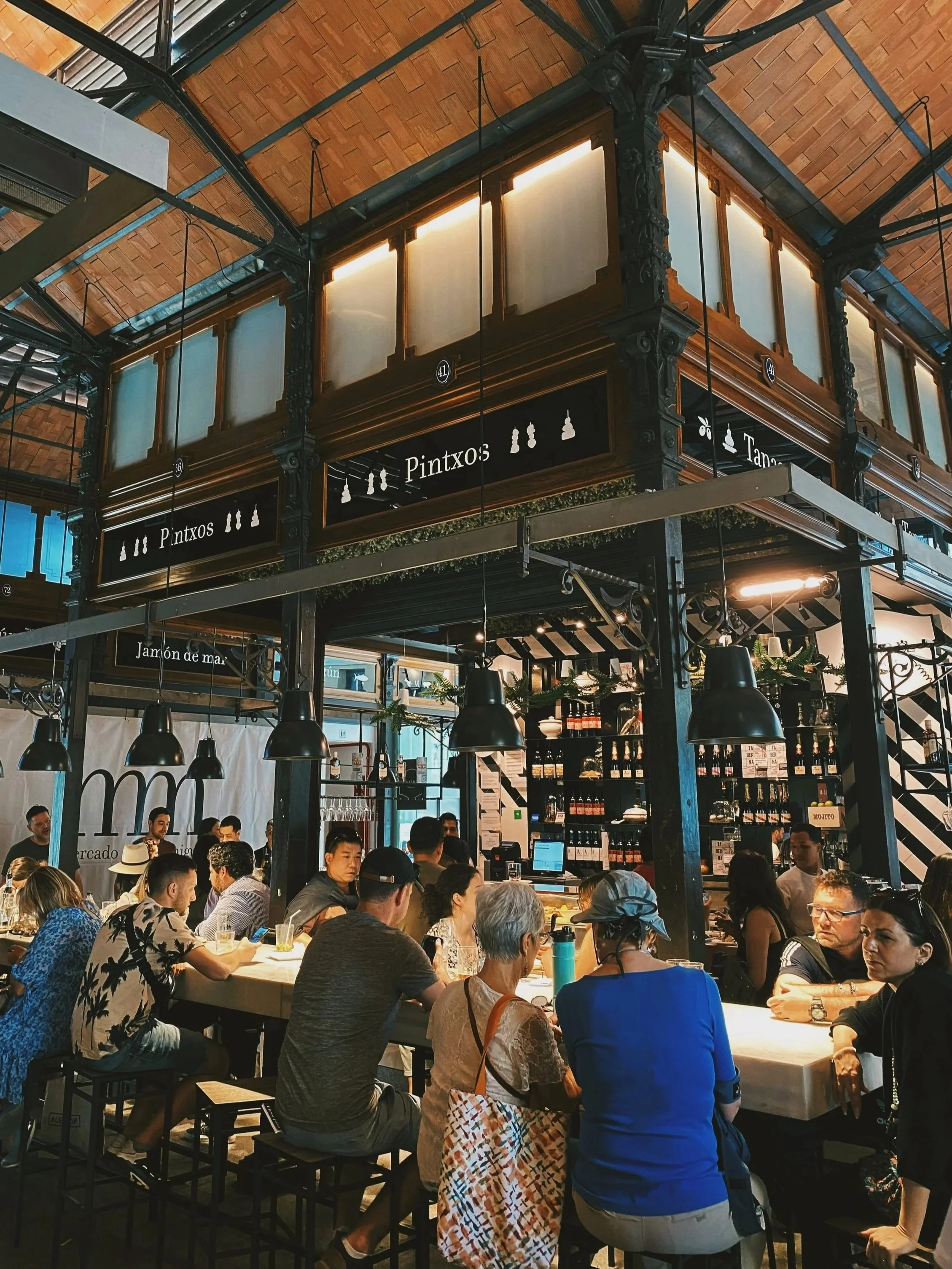 Crowded stalls inside the Mercado de San Miguel, Madrid