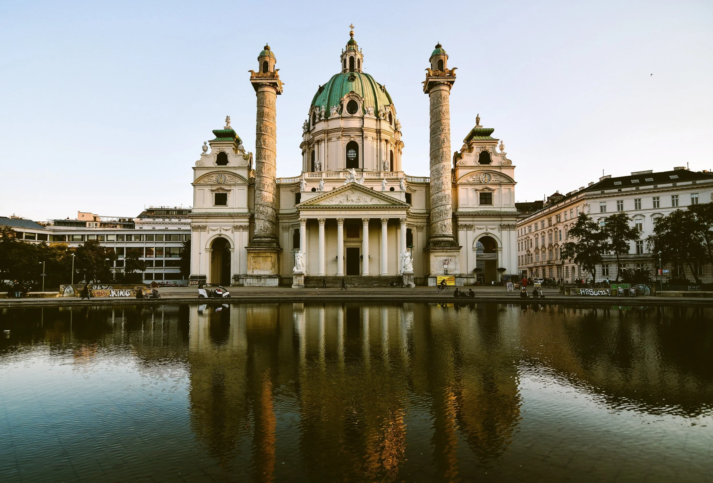 Karlskirche with its twin columns reflected in the pond, Vienna