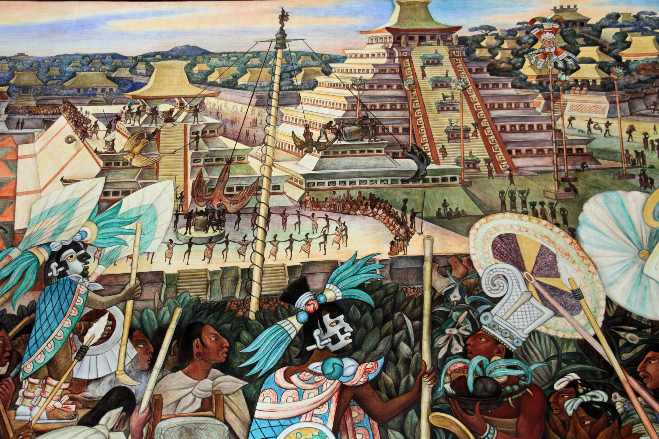 Diego Rivera mural showing a pre-Hispanic city with a stepped pyramid and market scenes, Mexico City.