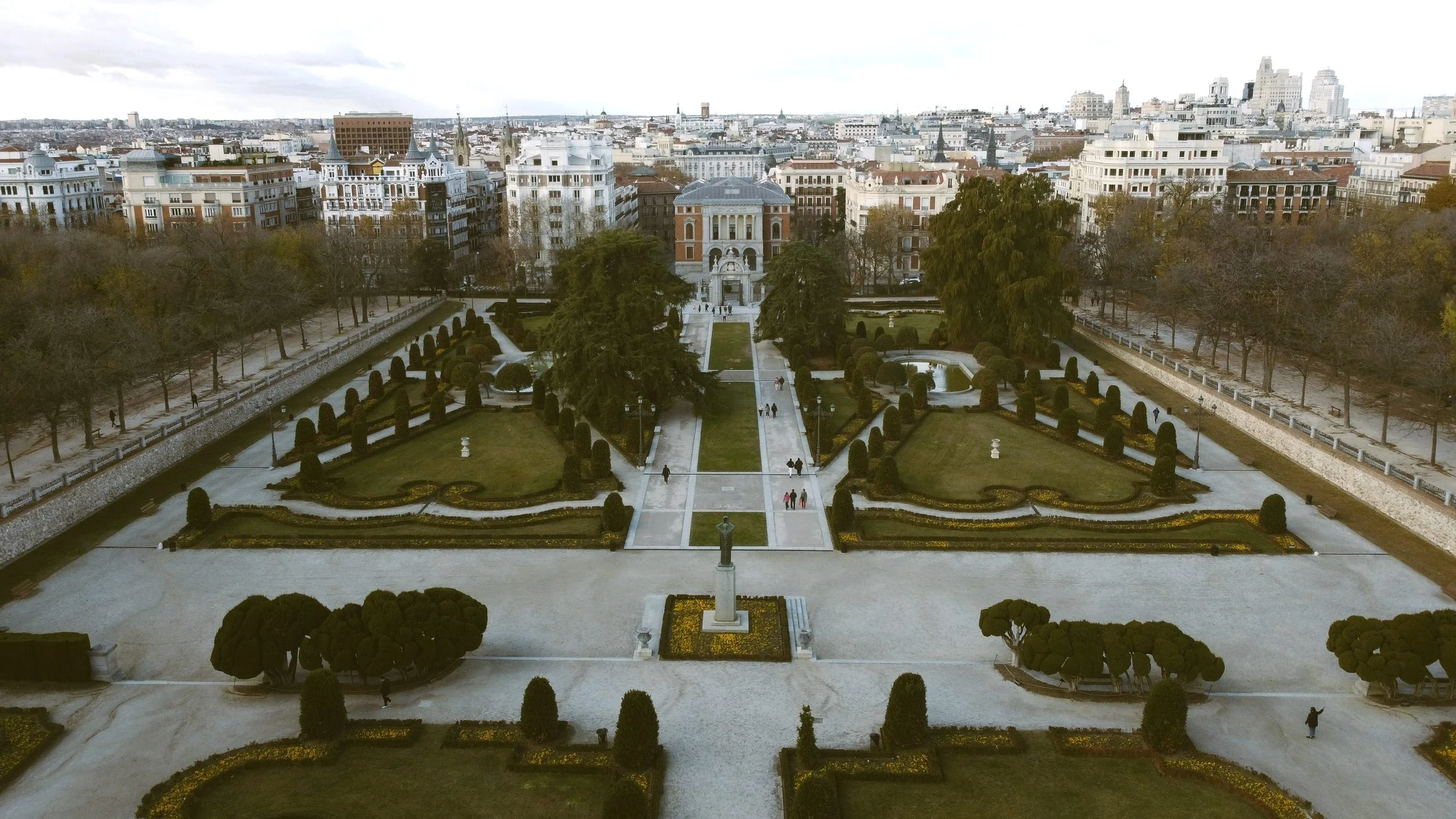 Aerial view of the Parterre garden with clipped hedges and a statue in Retiro Park, Madrid
