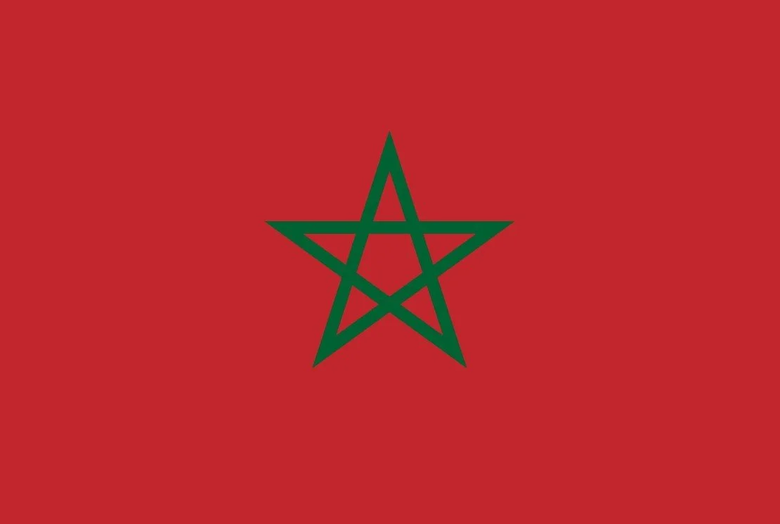 Flag of Morocco with a red background and a green pentagram star in the center.