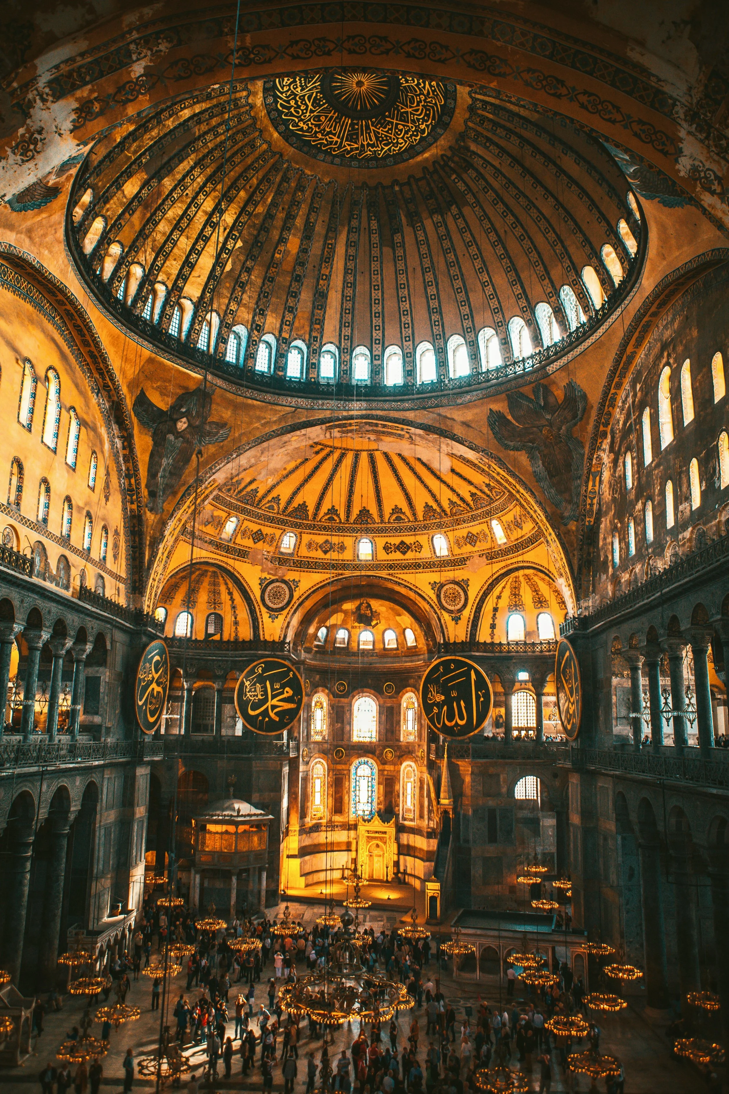Interior of Hagia Sophia with its central dome, golden mosaics and arched galleries, Istanbul.