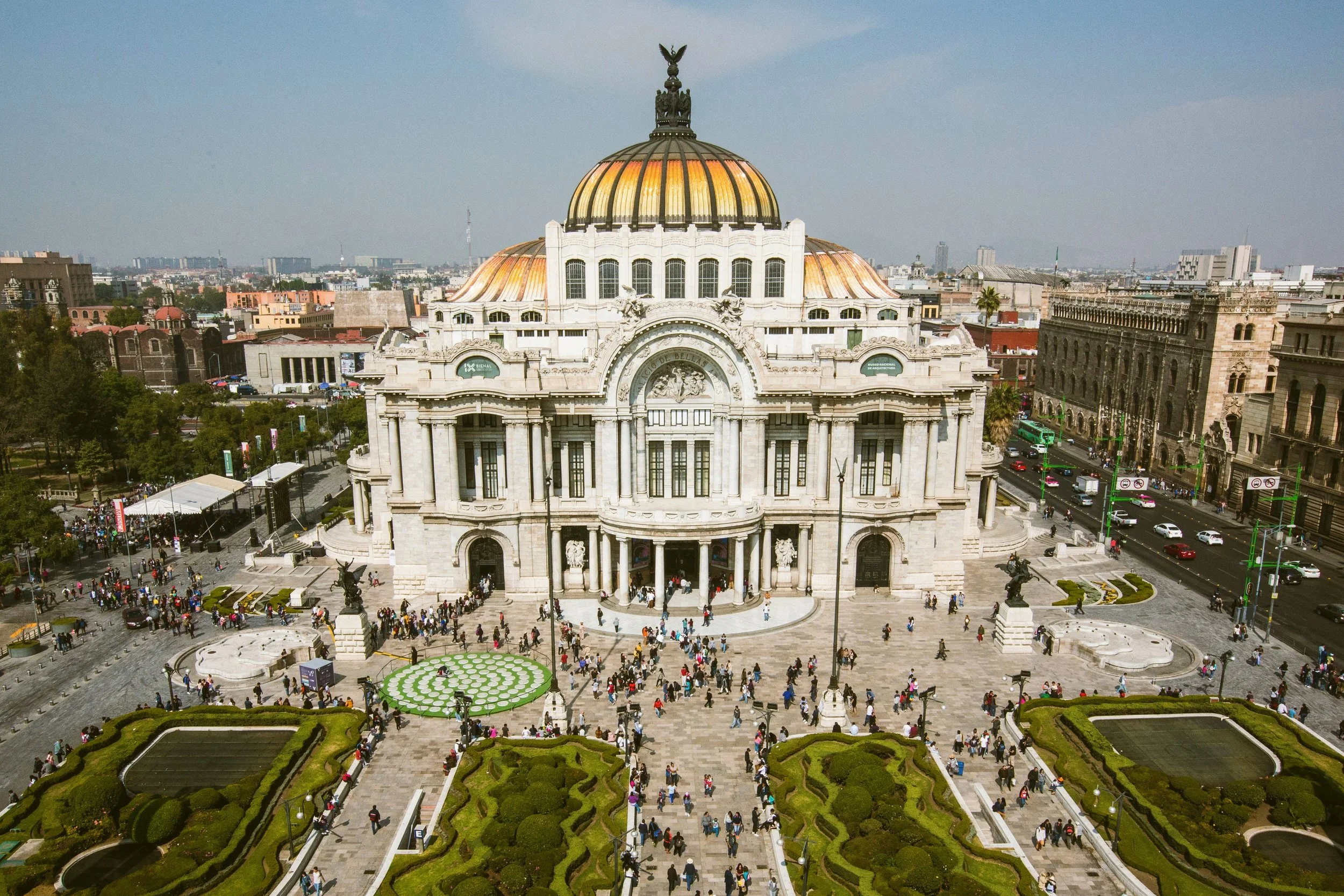 Palacio de Bellas Artes with its golden dome and gardens in front, Mexico City.