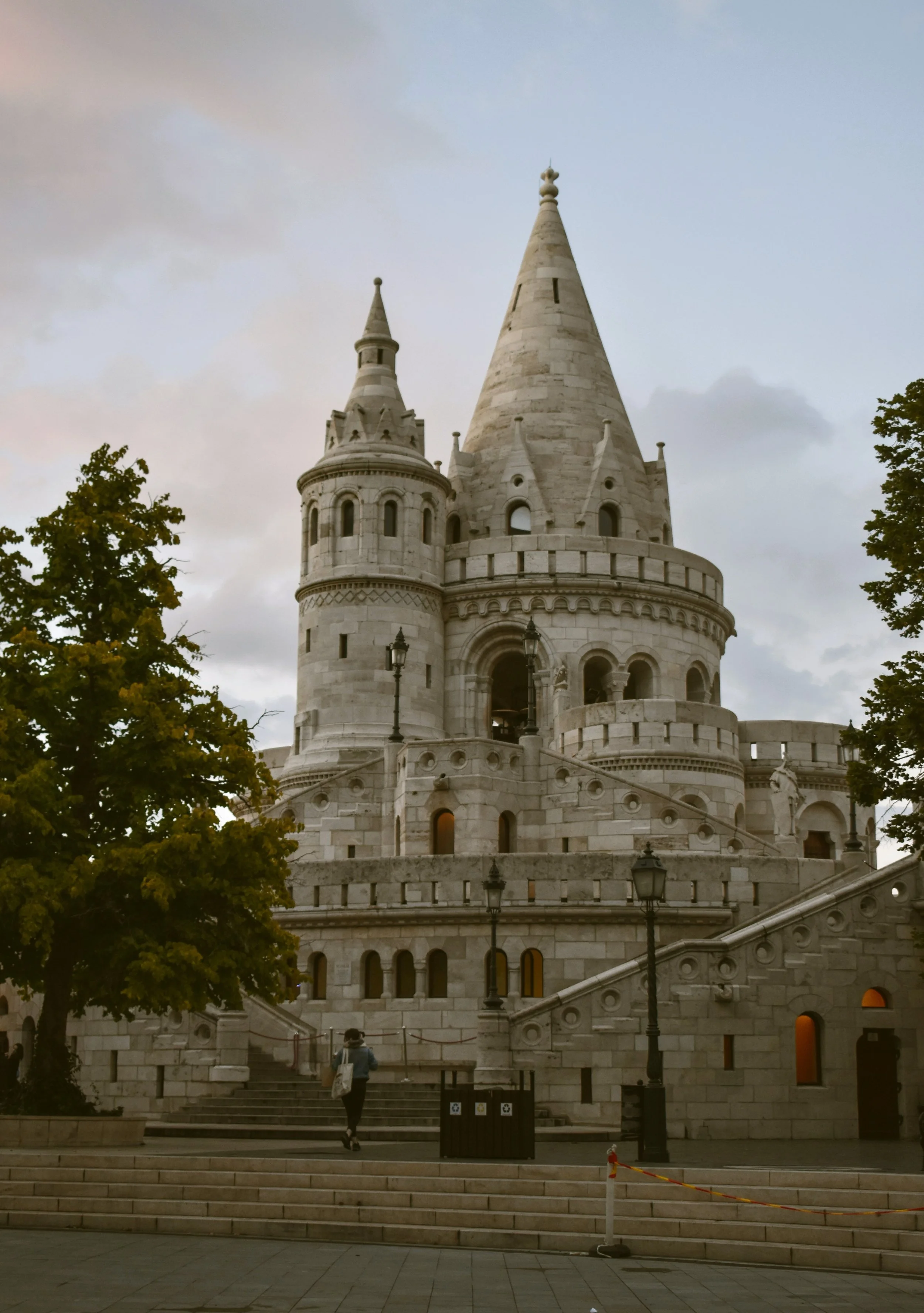 Conical turret of Fisherman's Bastion under a cloudy sky, Budapest