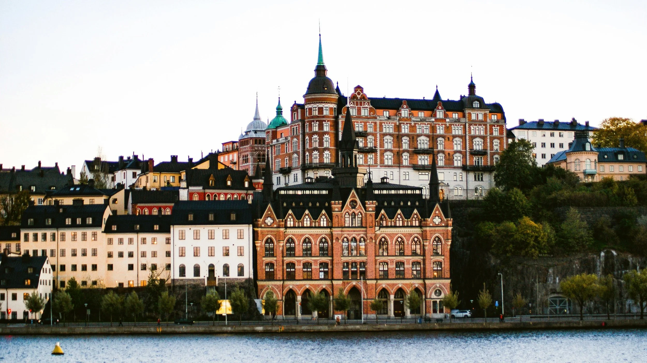 Historic brick buildings on the Södermalm waterfront seen across the water, Stockholm