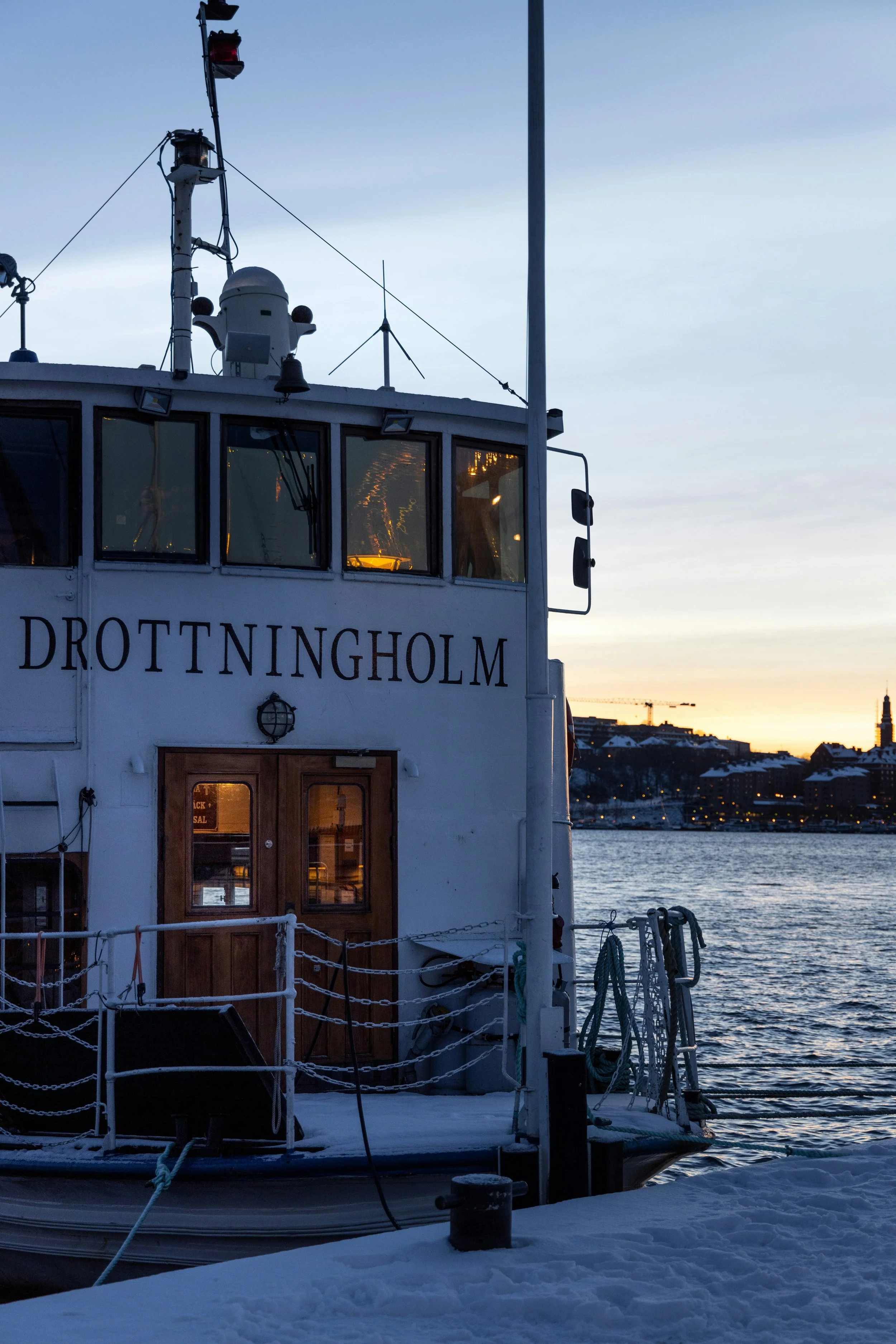 Drottningholm passenger ferry moored at a quay at dusk, Stockholm