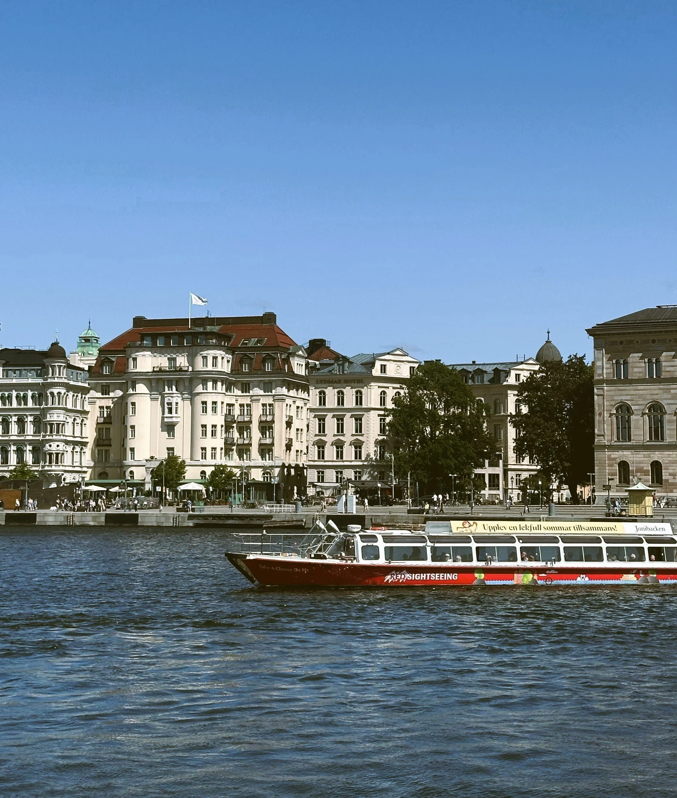 Passenger boat in front of waterfront buildings, Stockholm