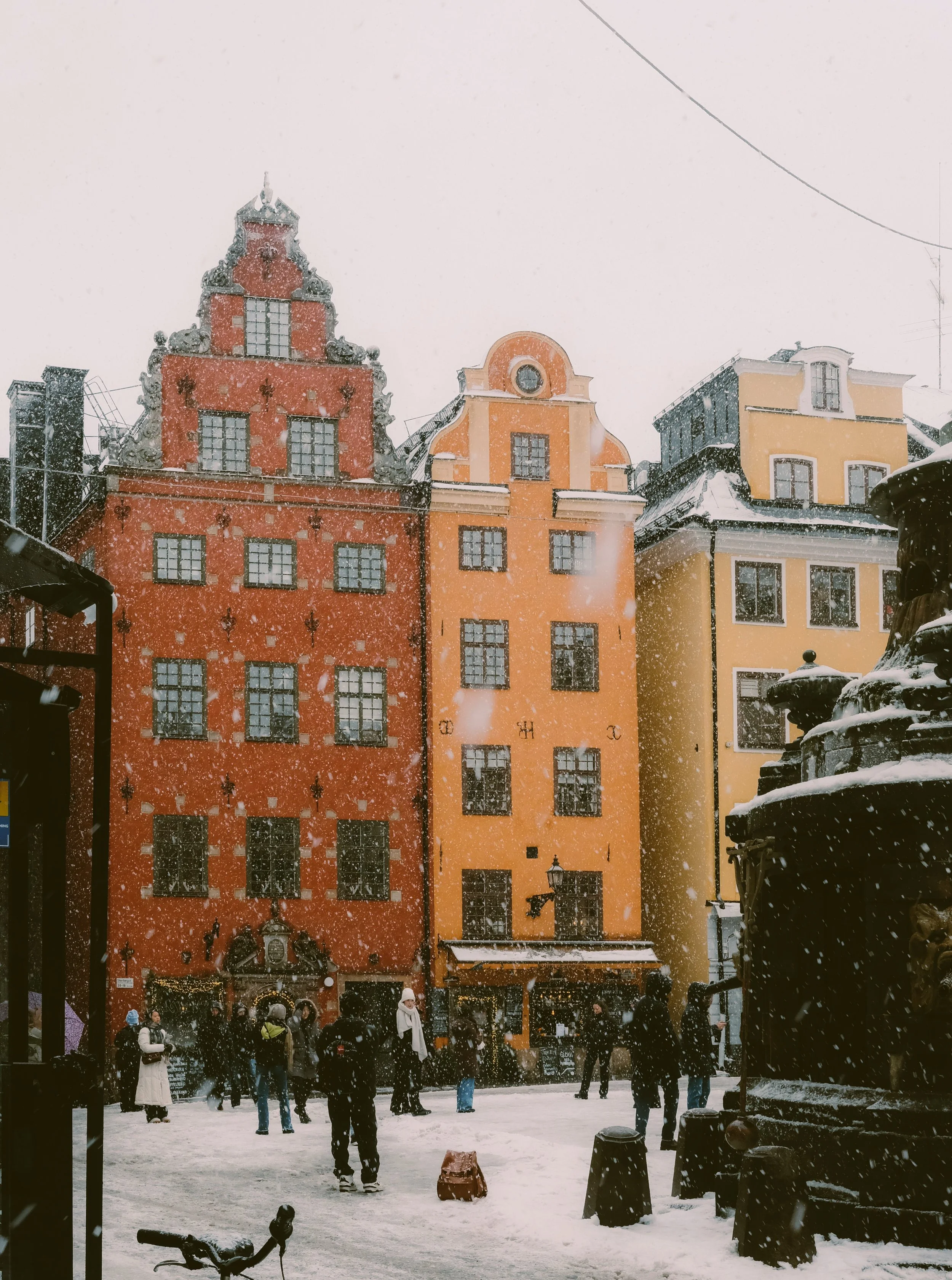Red and ochre gabled townhouses on Stortorget square in Gamla Stan, Stockholm