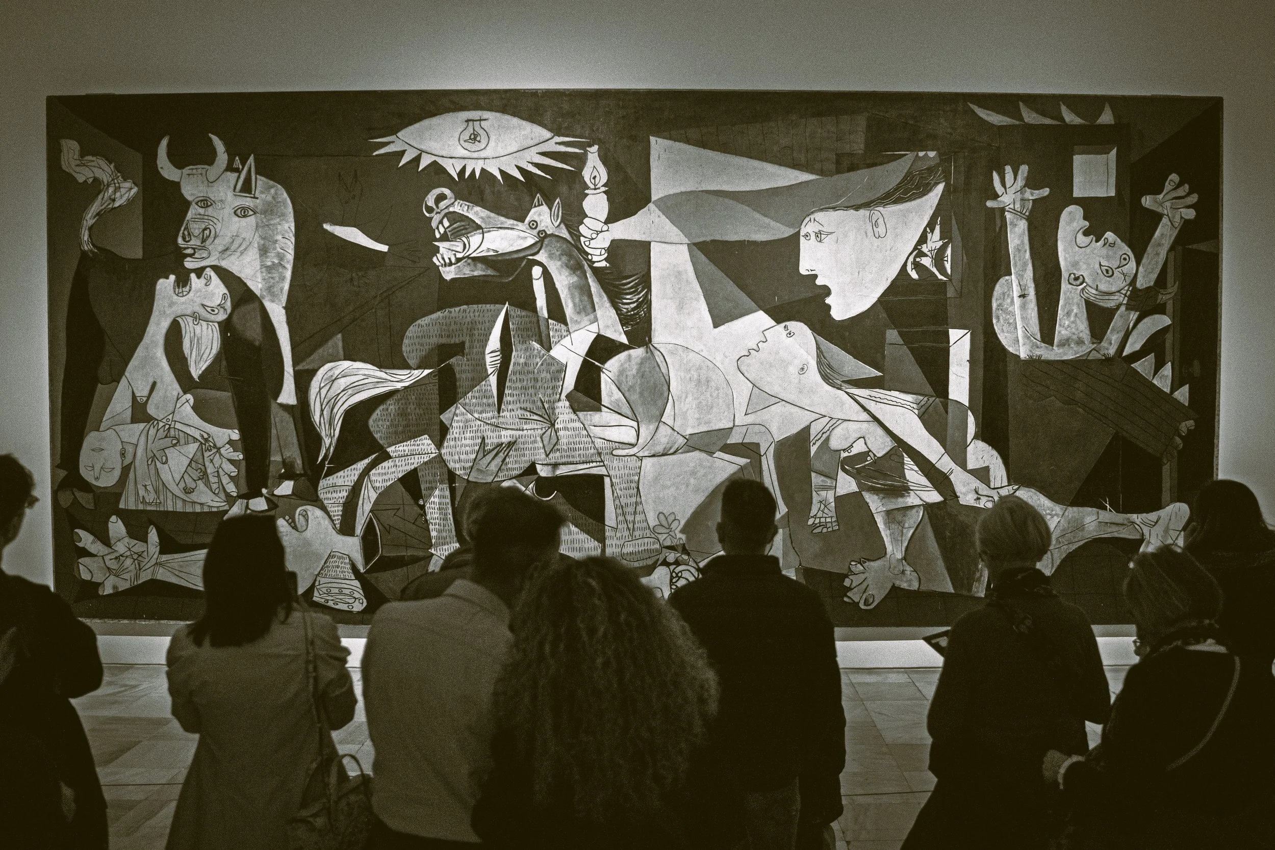 Visitors viewing Picasso's Guernica at the Museo Reina Sofía, Madrid