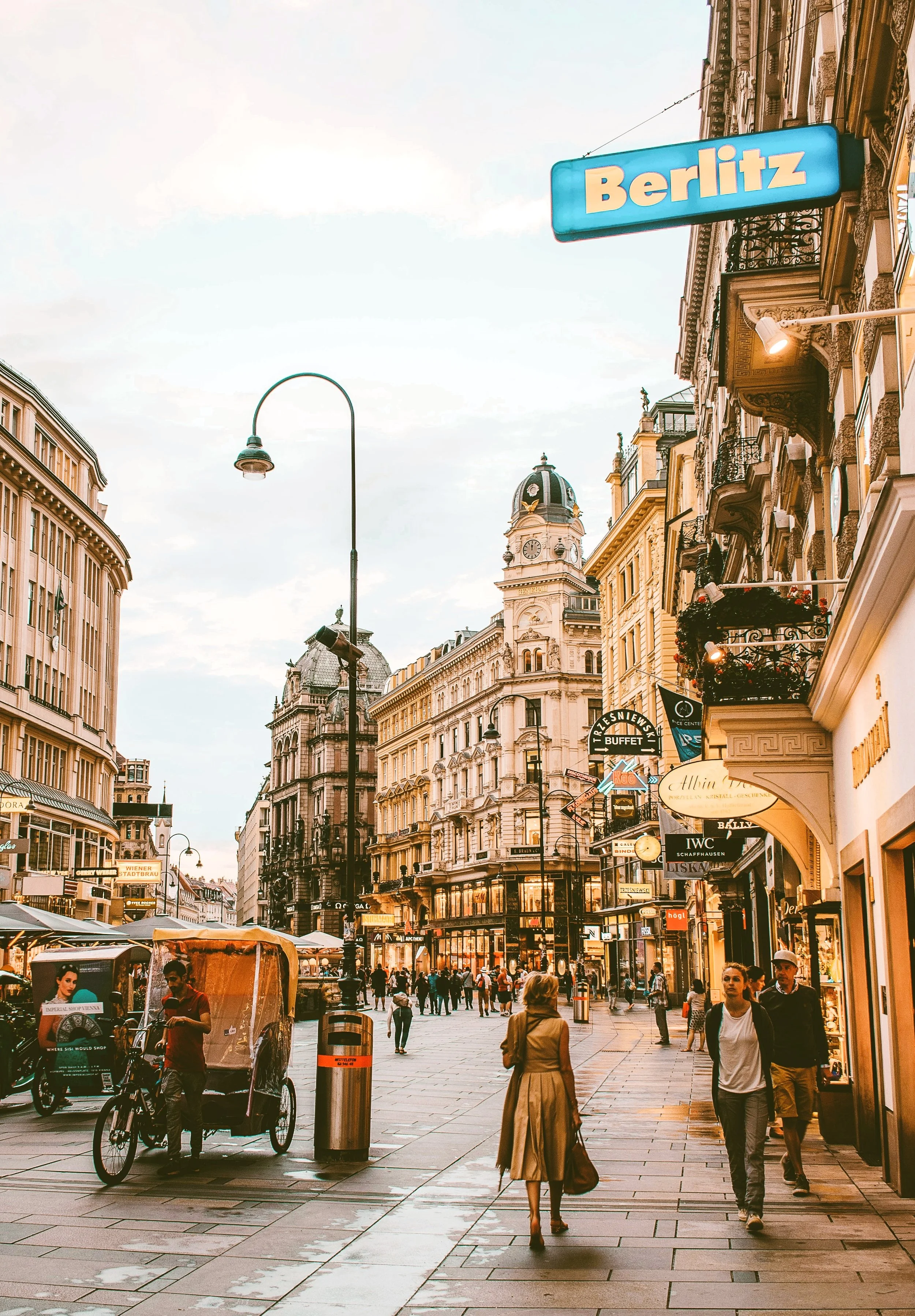 Pedestrians walking along Graben street lined with historic buildings, Vienna.