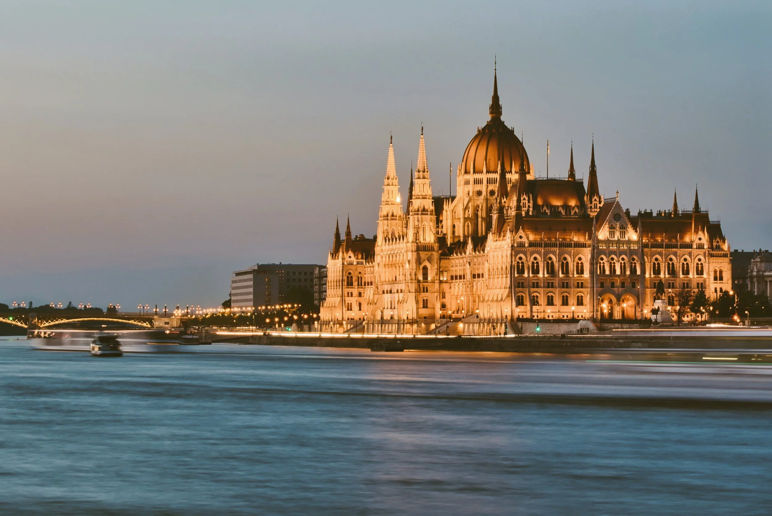 Hungarian Parliament Building glowing at sunset across the Danube, Budapest