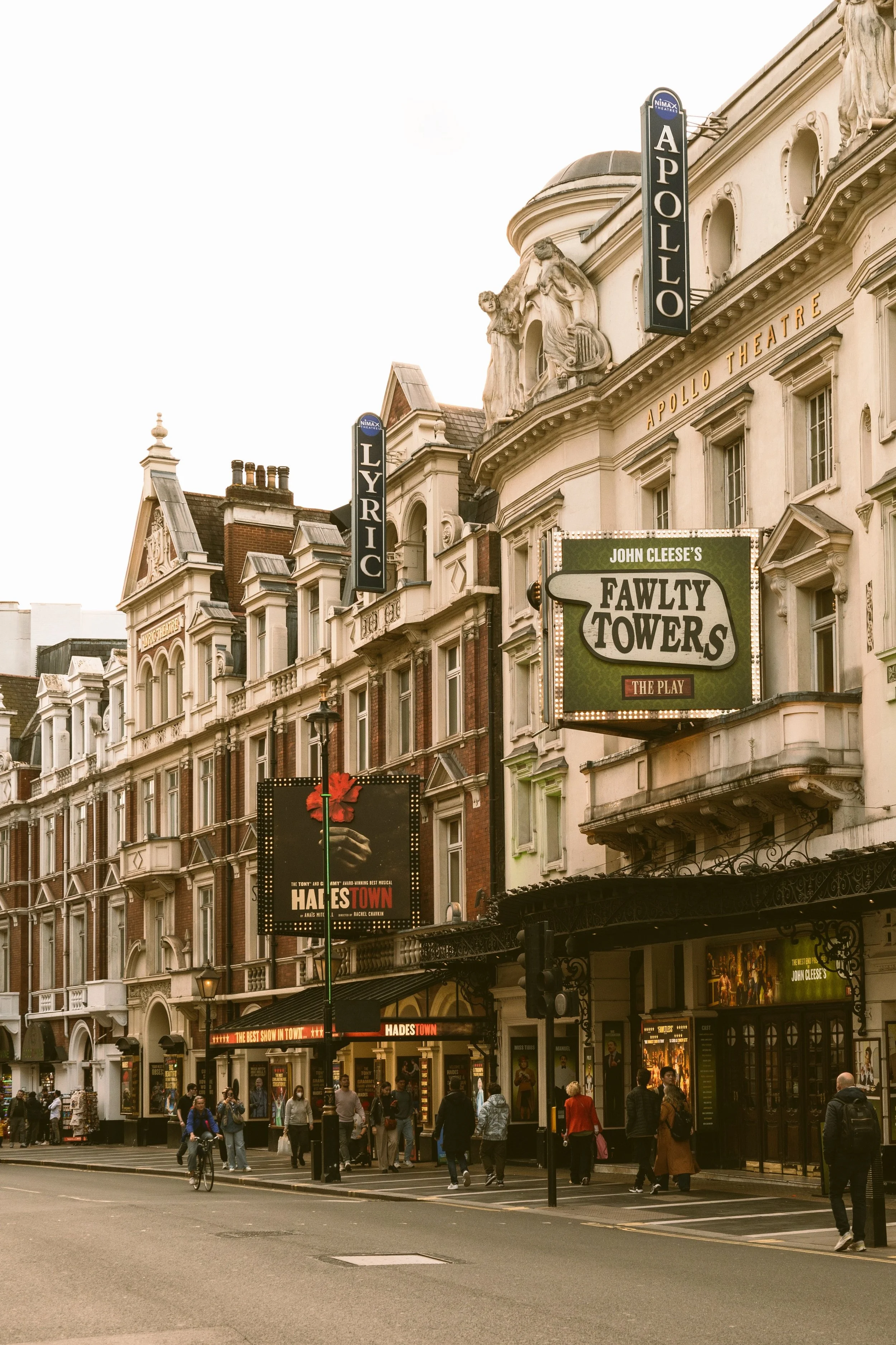 Row of historic shopfronts on a quiet West End street in the early morning light, London