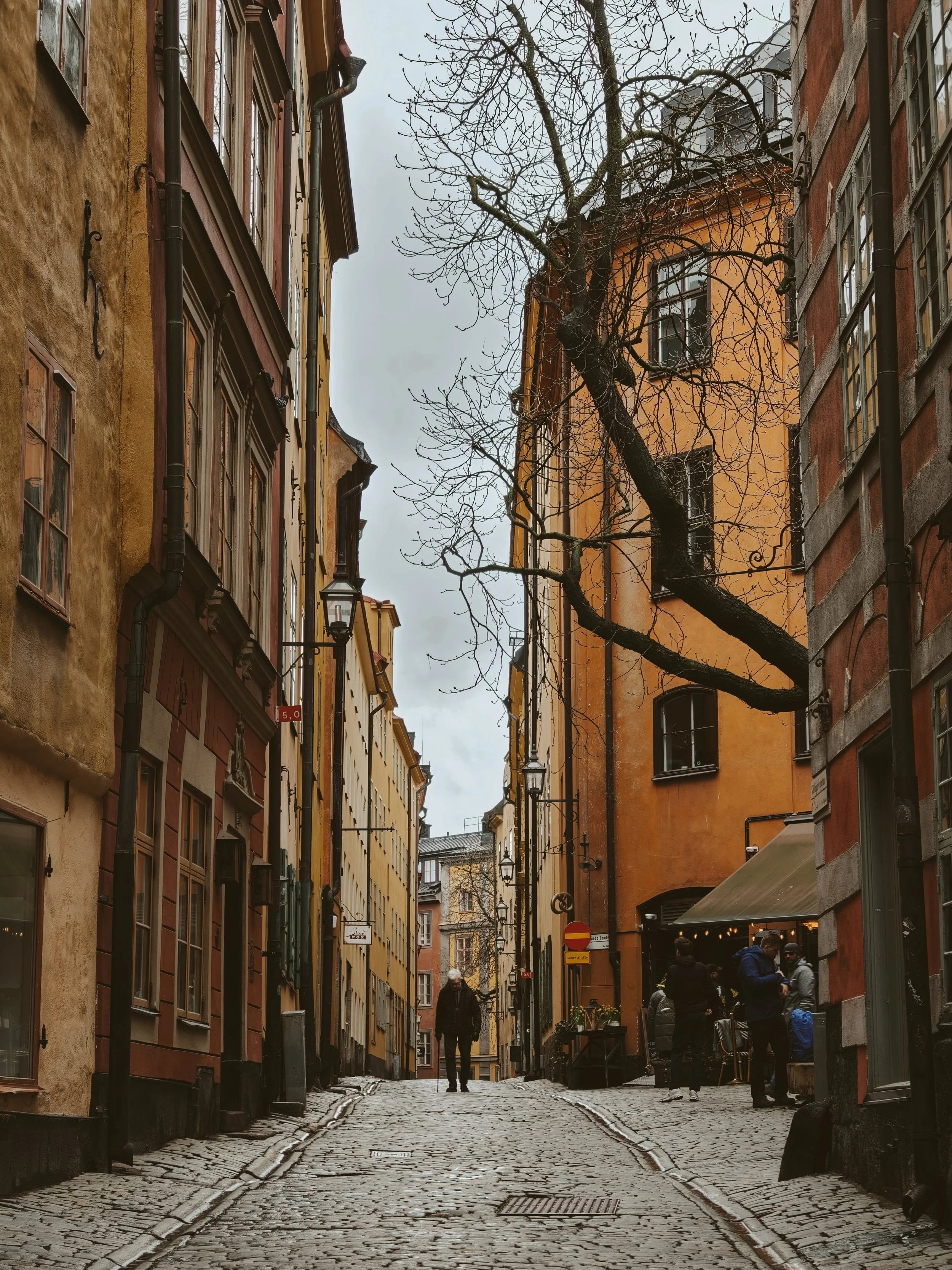 Quiet cobbled lane in Gamla Stan with warm-toned buildings, Stockholm
