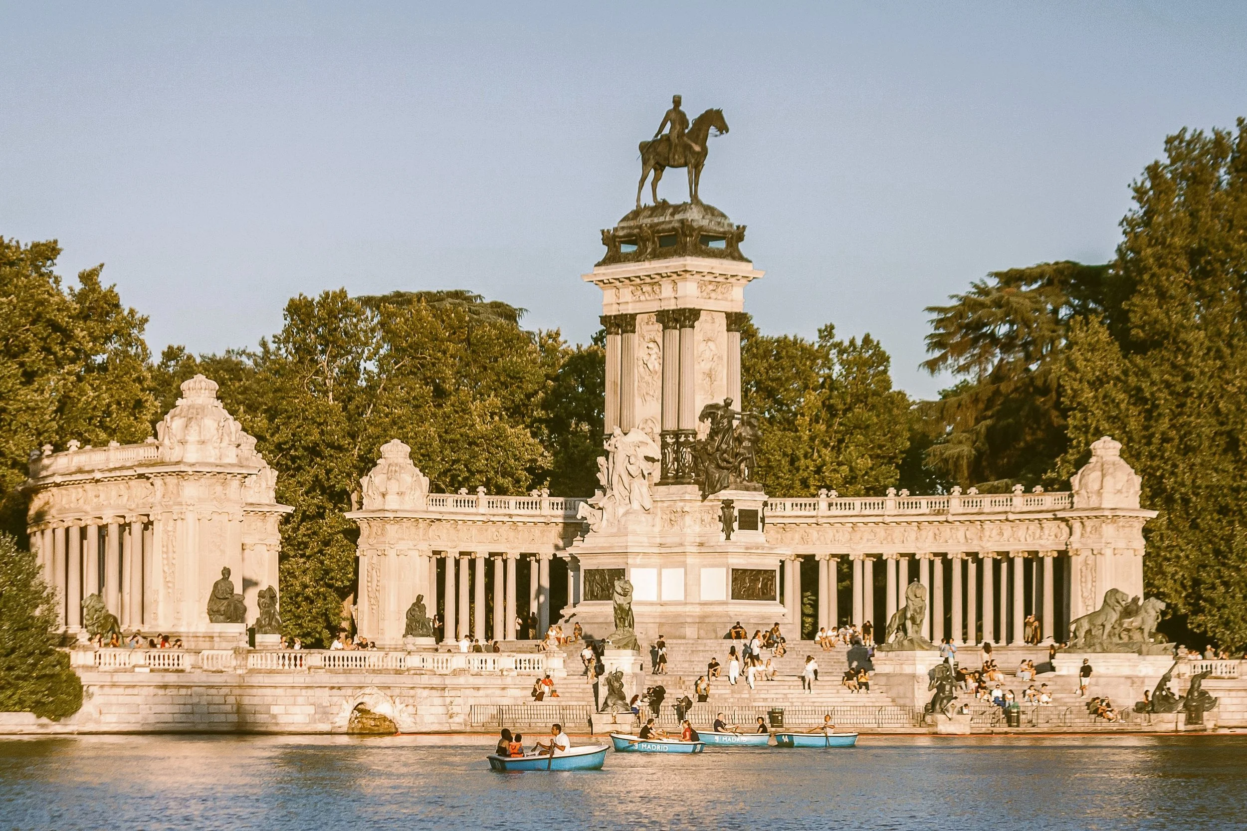 Alfonso XII Monument with its colonnade and equestrian statue above the Retiro pond, Madrid
