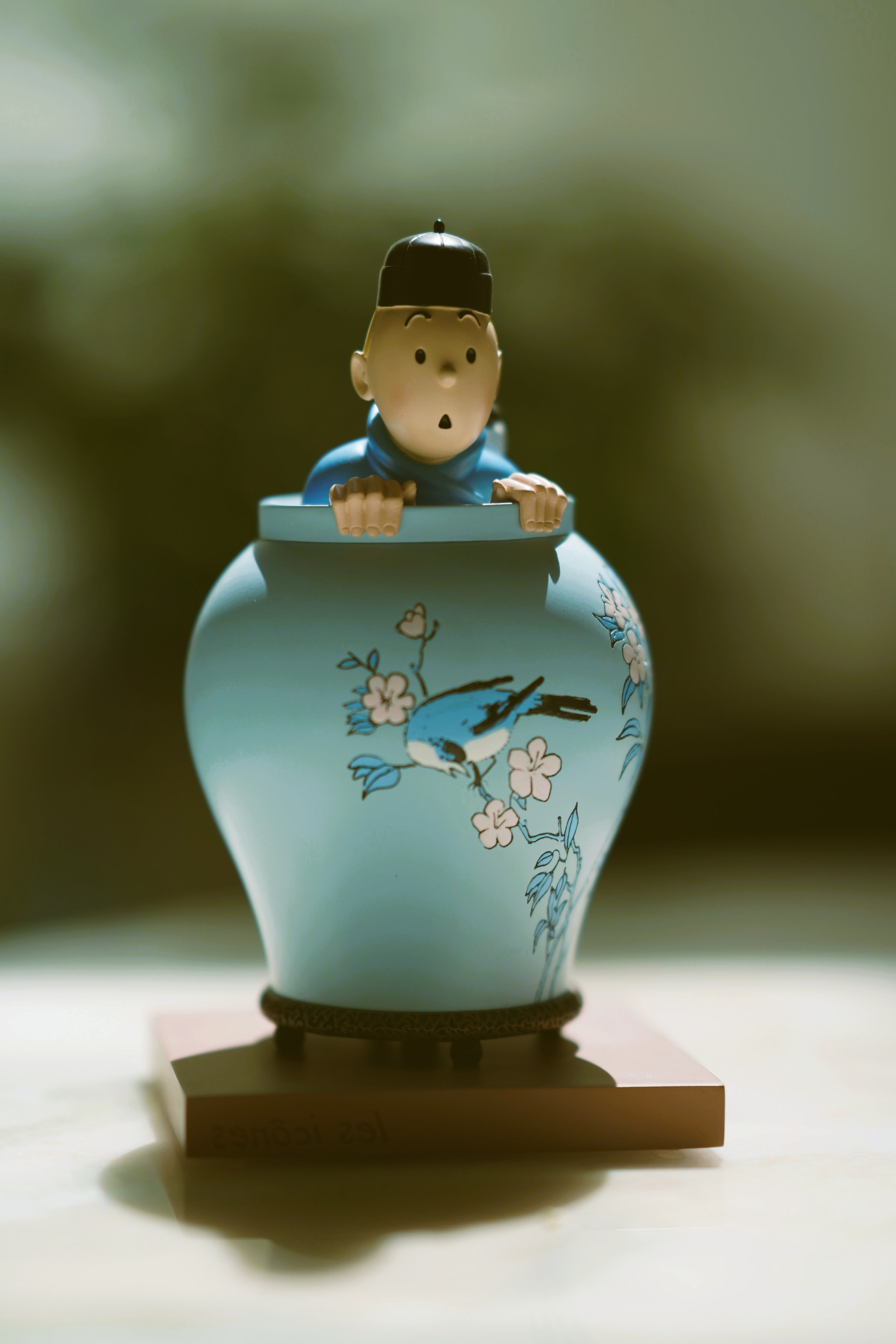 Tintin collectible figurine in a turquoise Chinese-style vase, Blue Lotus inspired