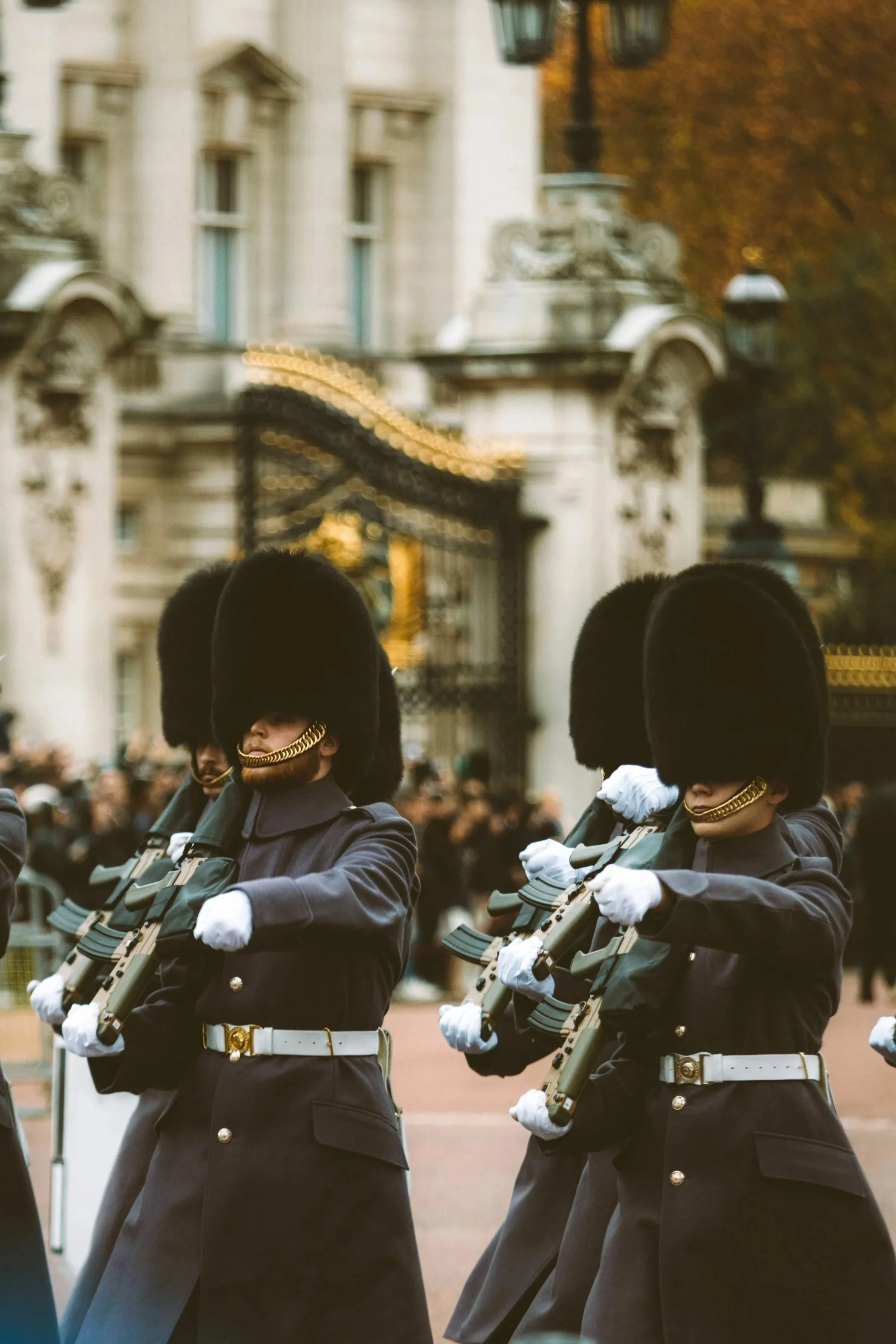 Royal guards in bearskin hats marching in formation, London