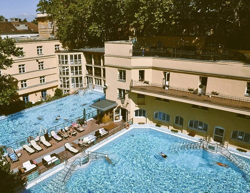 Outdoor thermal pools with sun loungers at Lukács Thermal Bath, Budapest