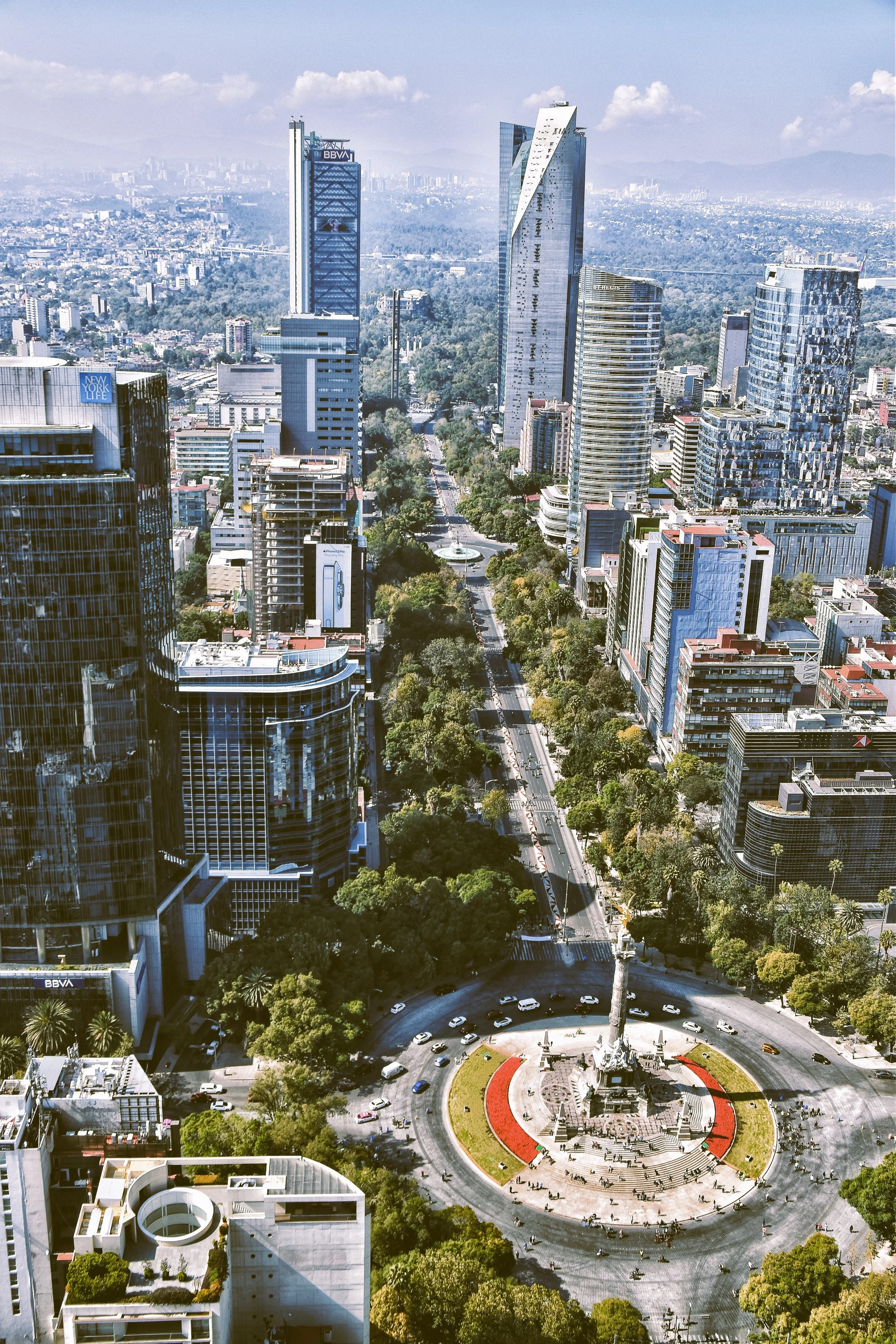 Aerial view of Paseo de la Reforma with a roundabout and skyscrapers along the avenue, Mexico City.