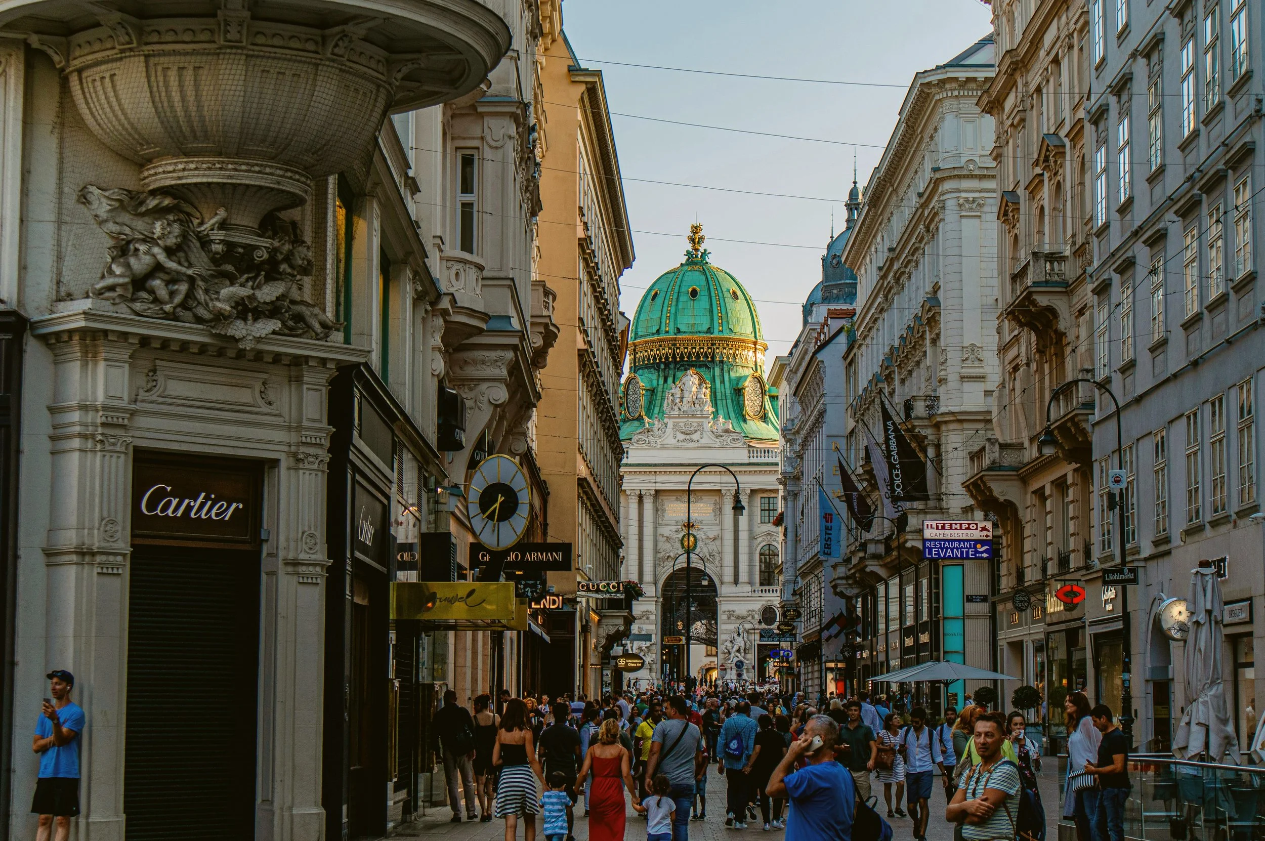 Crowded street in the Innere Stadt with a view of the Hofburg, Vienna.