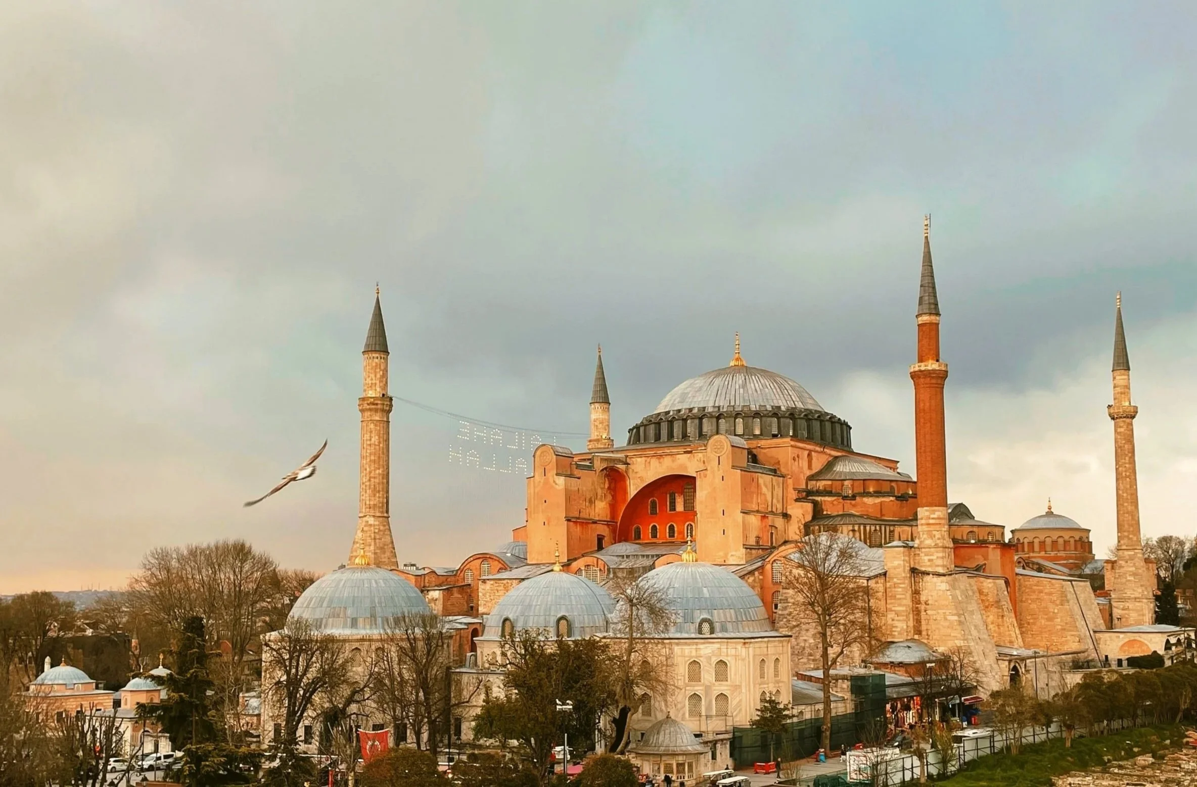 Hagia Sophia with its four minarets seen at dusk under a cloudy sky, Istanbul.