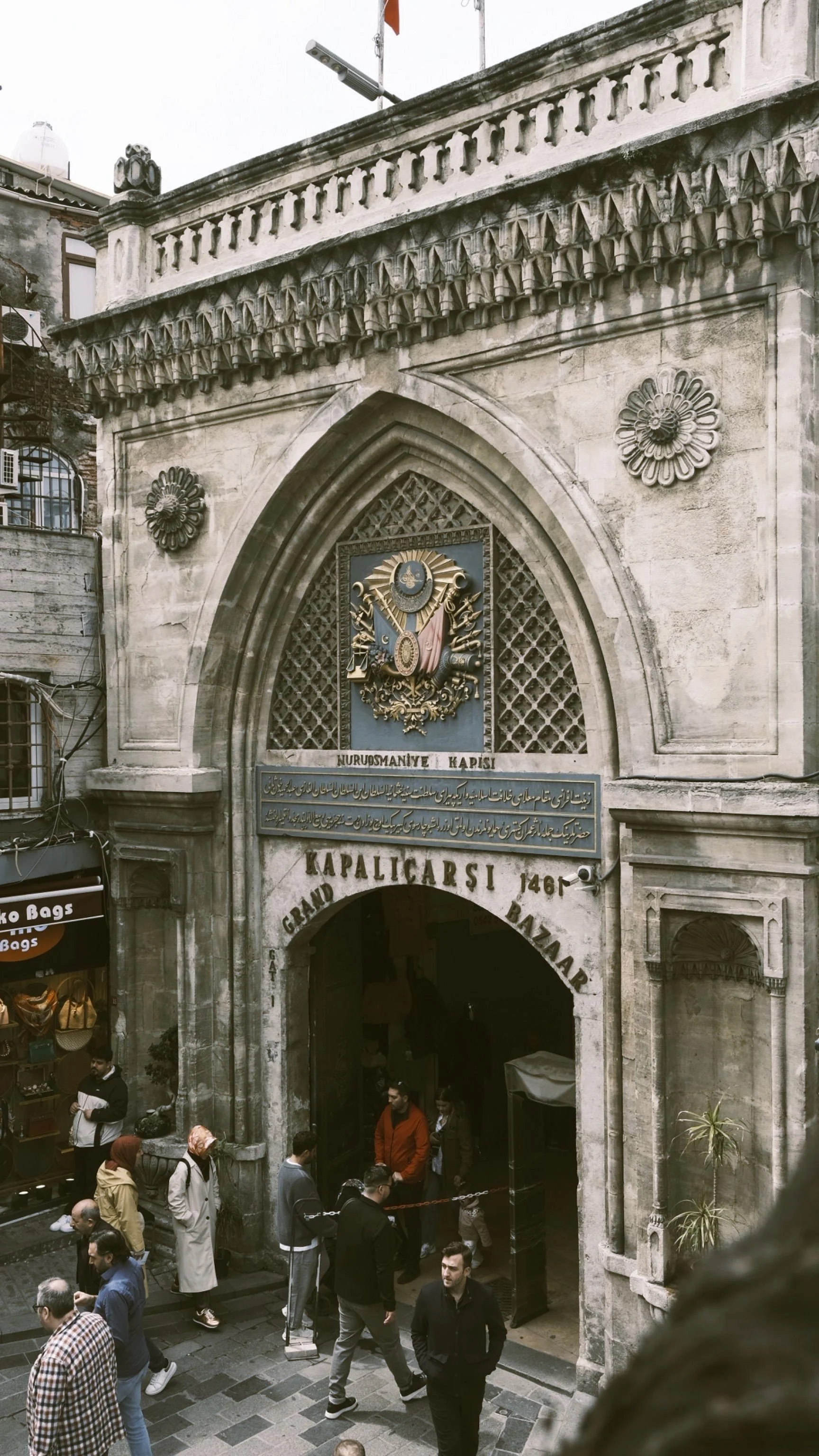 Ornate stone gateway with a pointed arch and carved details at an entrance to the Grand Bazaar, Istanbul.