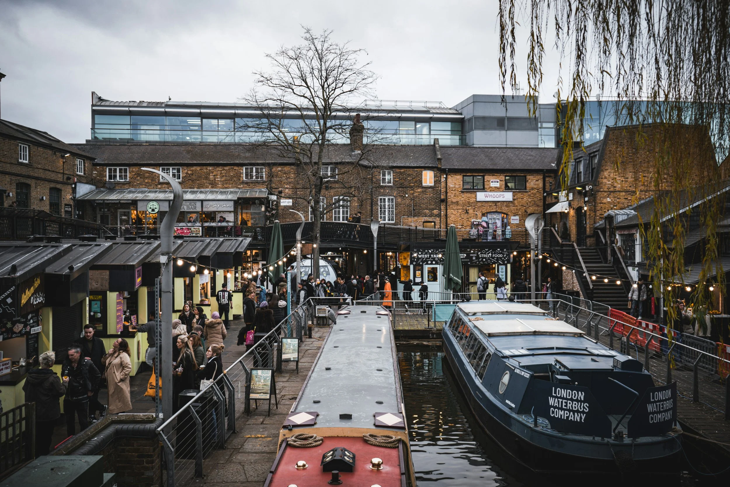 Aerial view of Camden Market with a narrowboat moored on the canal, London.