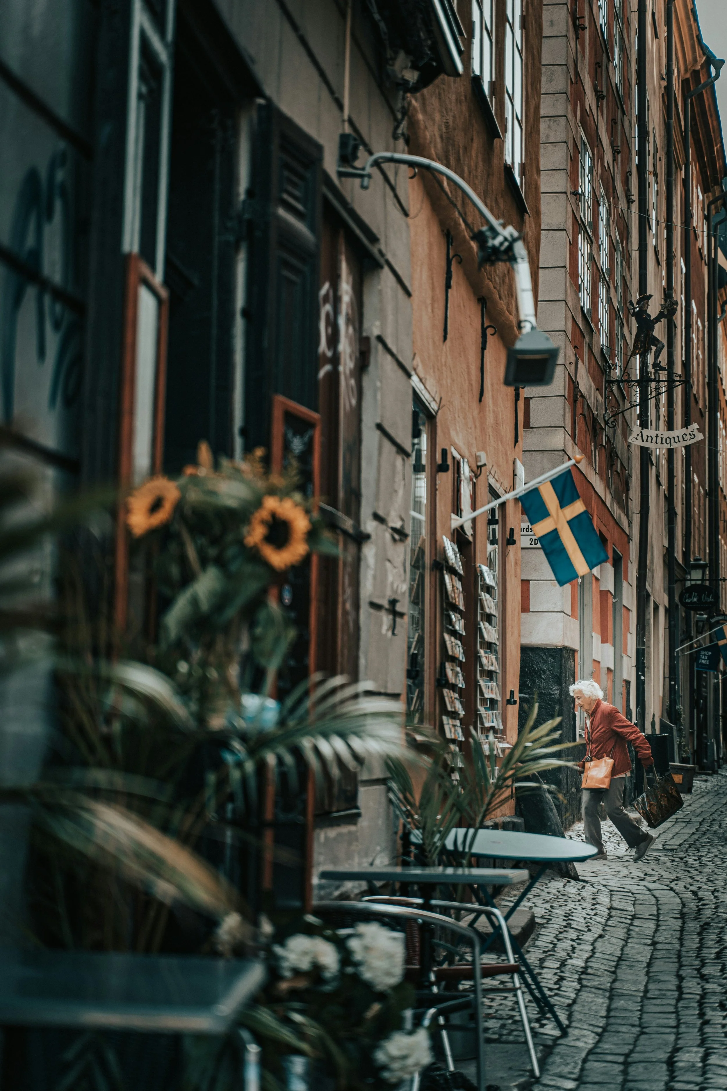 Narrow street with café tables in Gamla Stan, Stockholm