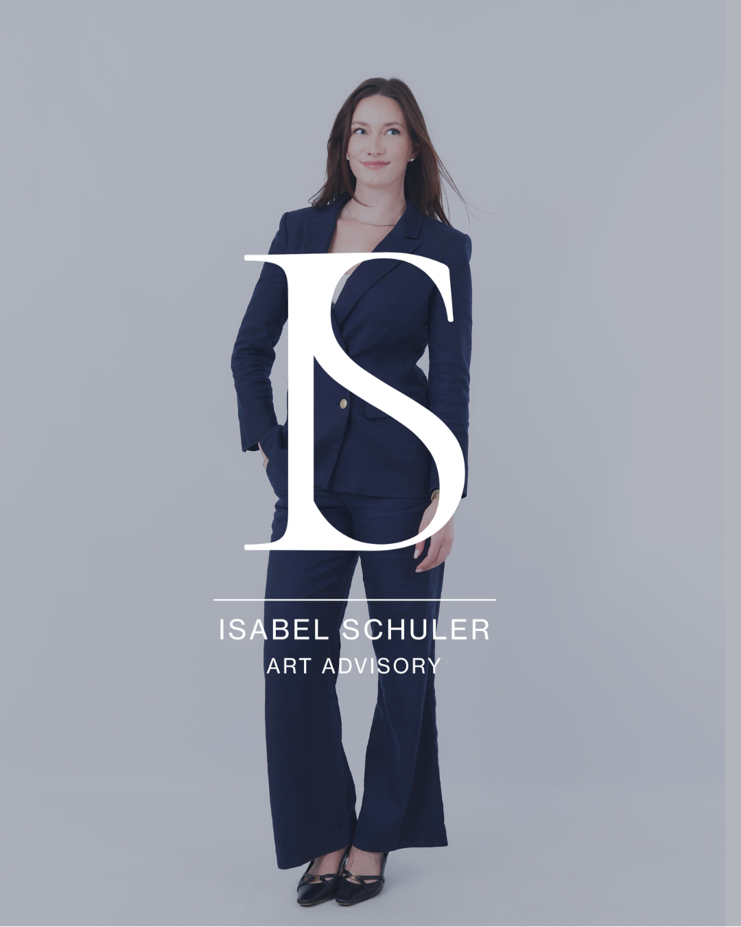 Woman in navy blue suit standing against a gray background with a large white letter 'IS' monogram and text 'ISABEL SCHULER ART ADVISORY' overlayed.