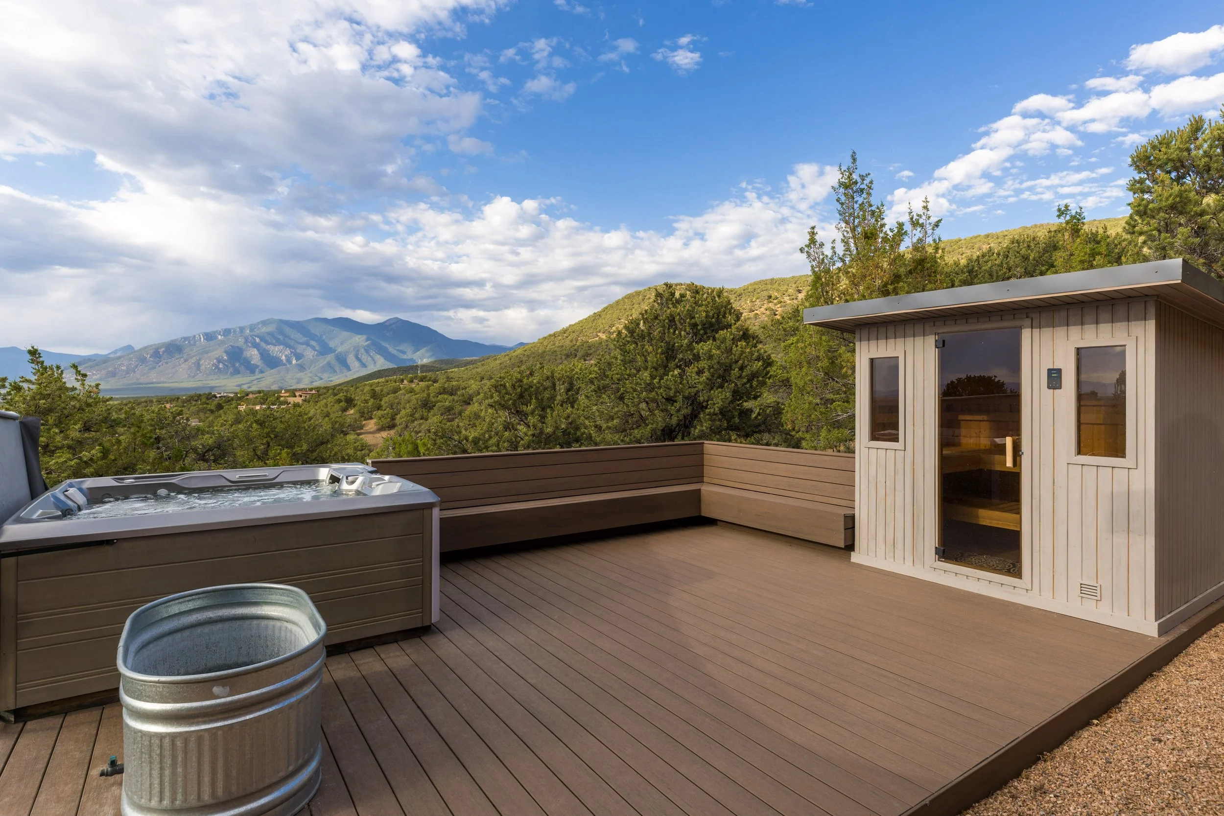 Private rooftop deck with hot tub and Sangre de Cristo mountain views at SENDERO luxury compound Taos NM