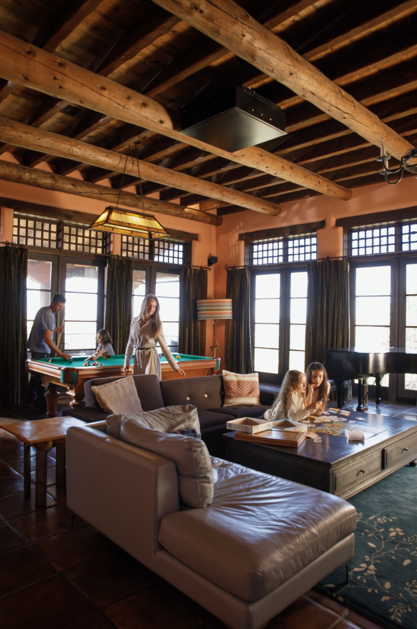 Game room with billiards table and vaulted wood-beam ceiling at SENDERO luxury estate, Taos New Mexico