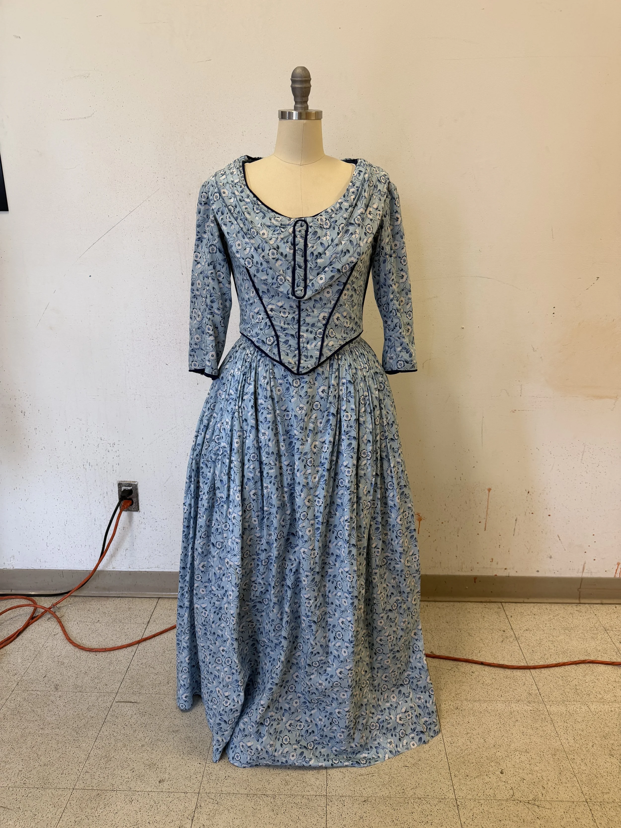 Finishing pleats on bodice, gathers on skirt, hem