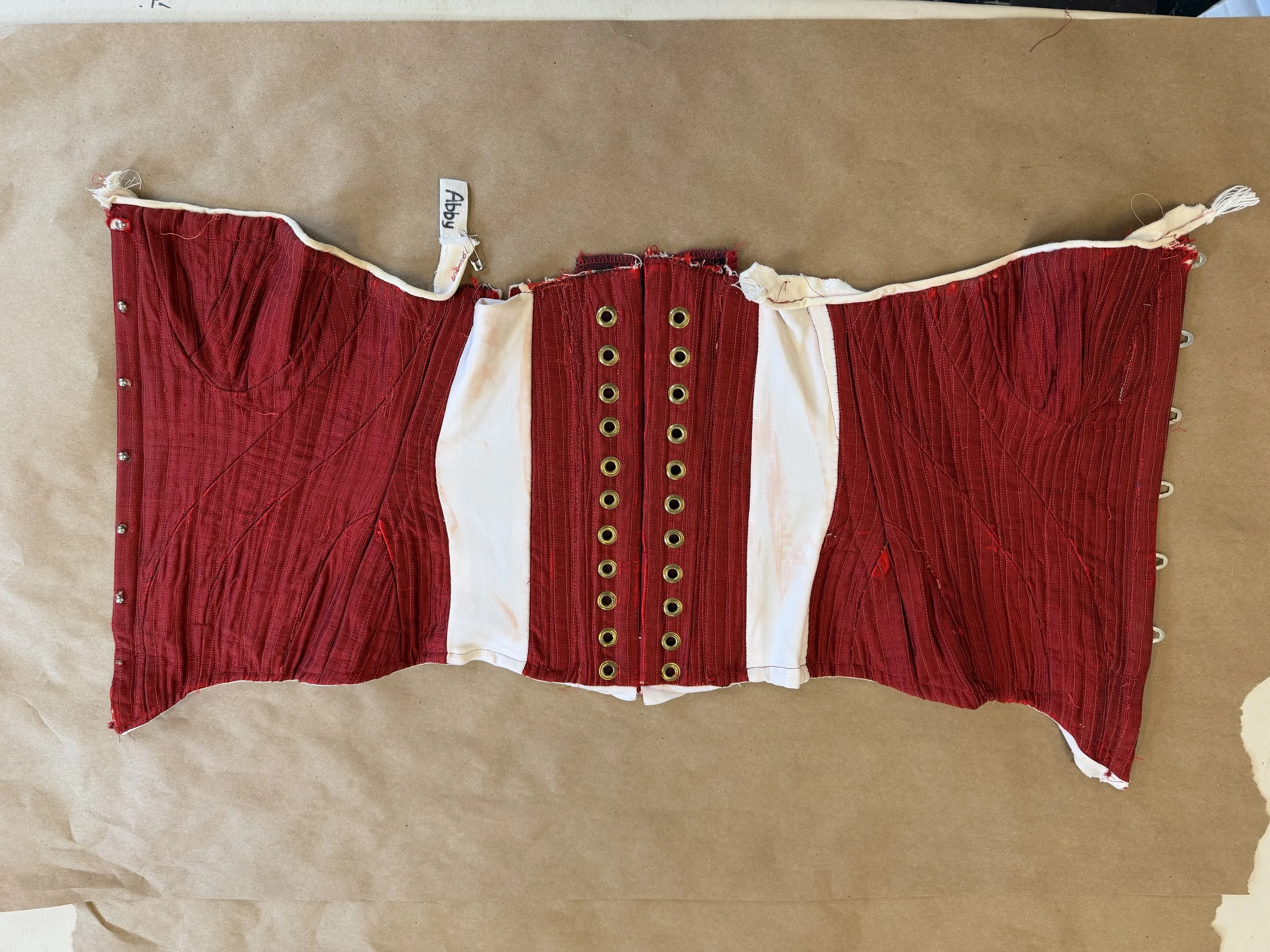 Attached stretch fabric to corset foundation