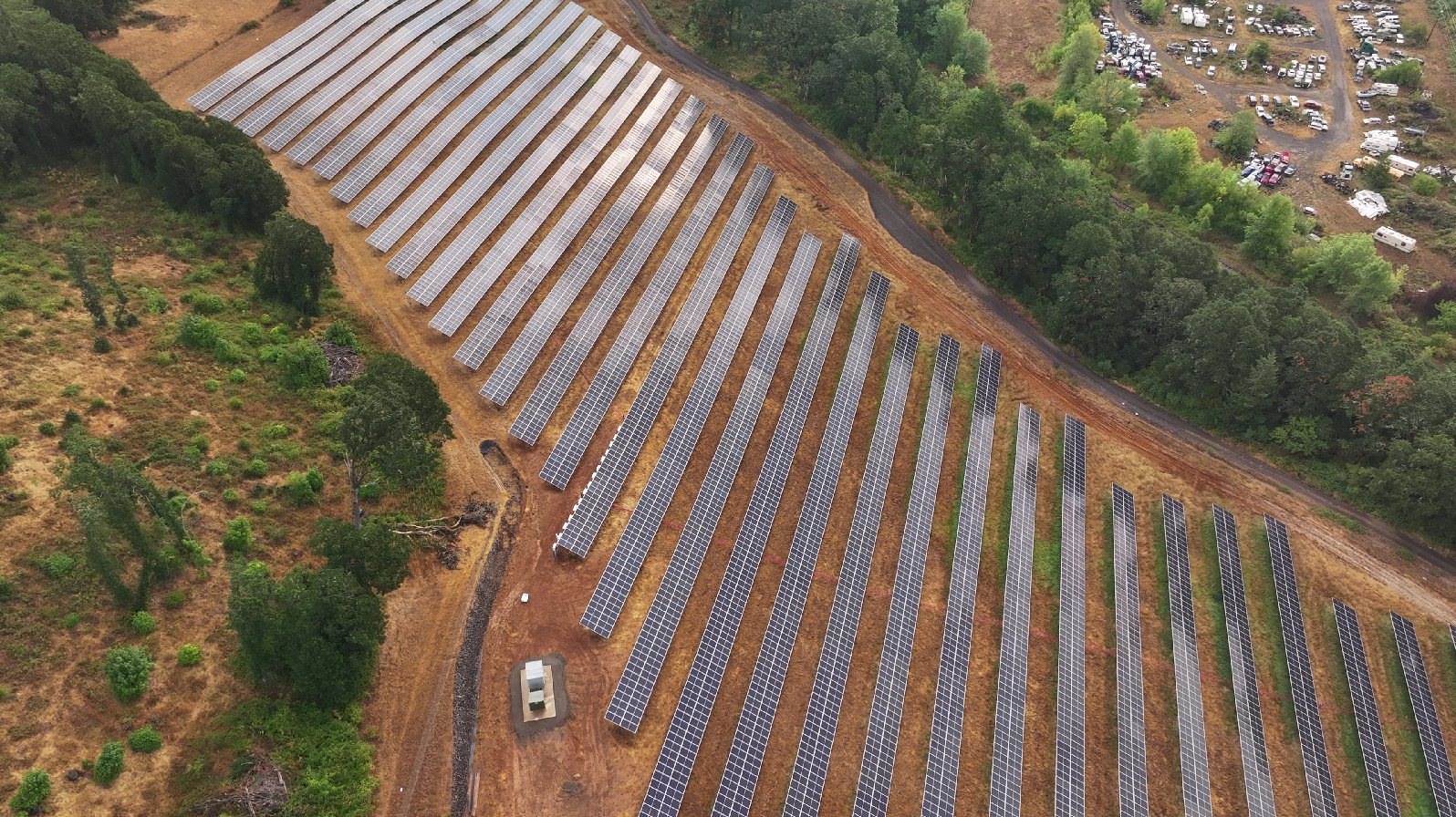 Photos and landscape images of affiliated solar farm projects.
