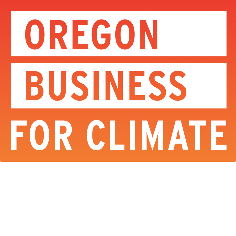 Sign with red and orange background reading 'Oregon Business for Climate' in bold white and red letters.